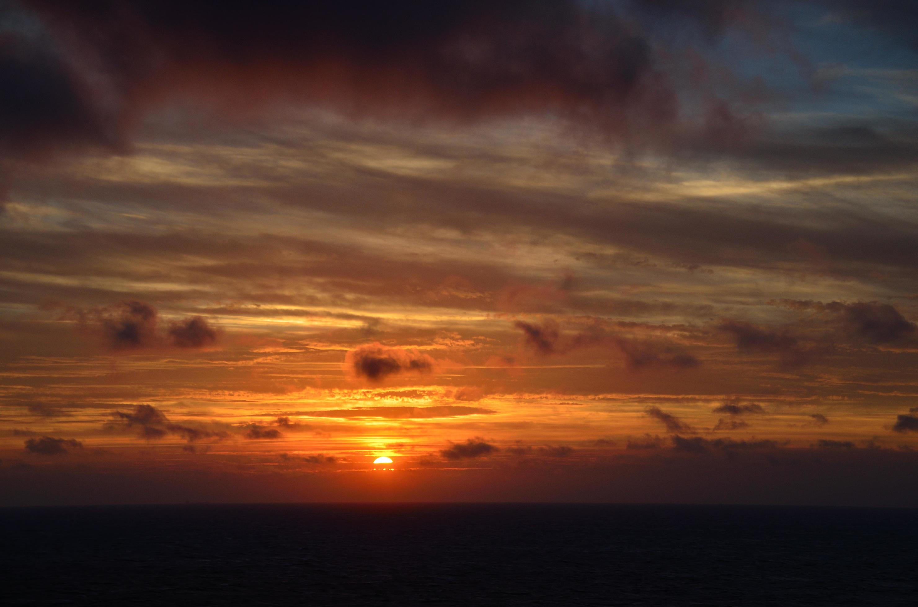 sunset on ship at sea Stock Free