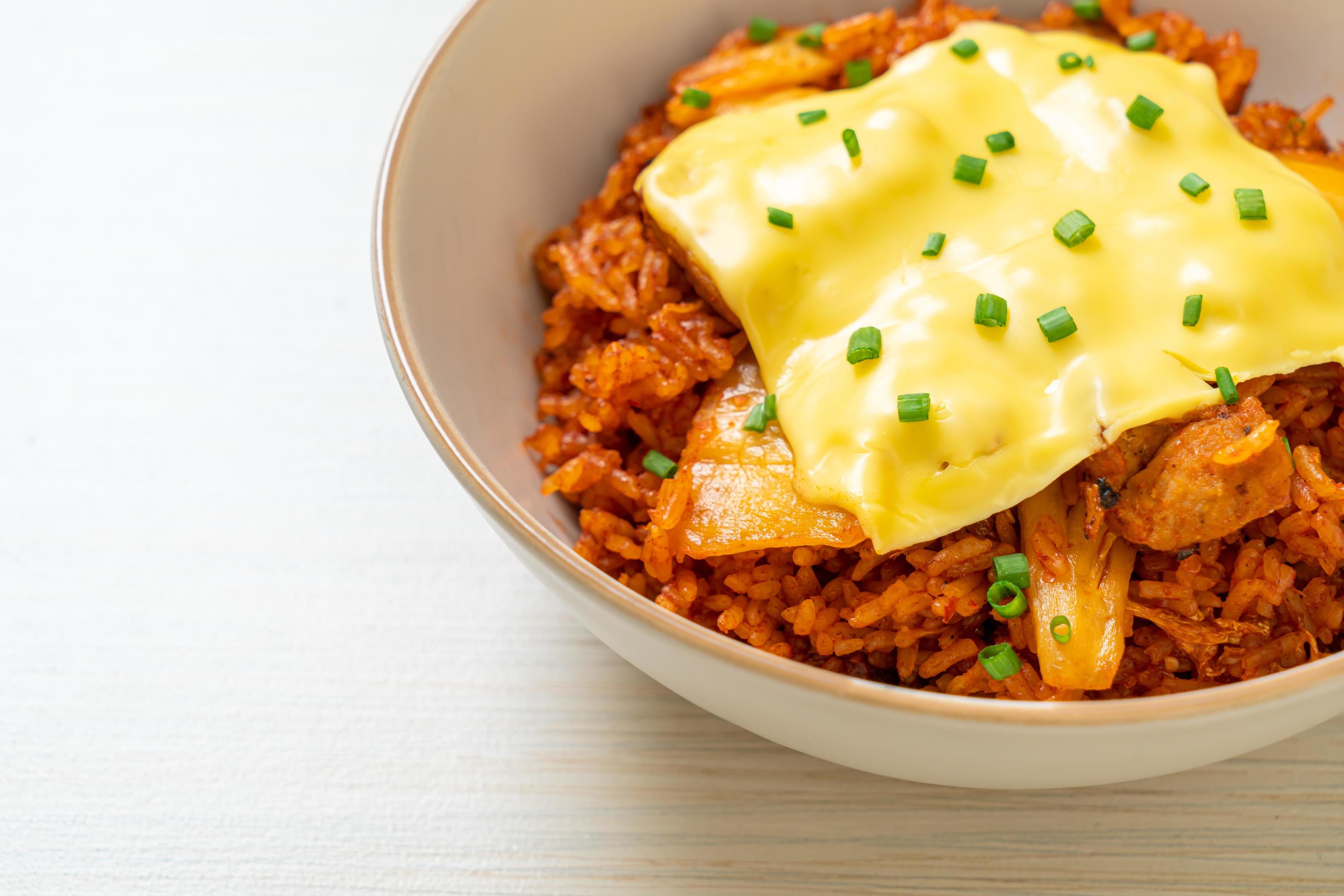 Kimchi fried rice with pork and topped cheese – Asian and fusion food style Stock Free