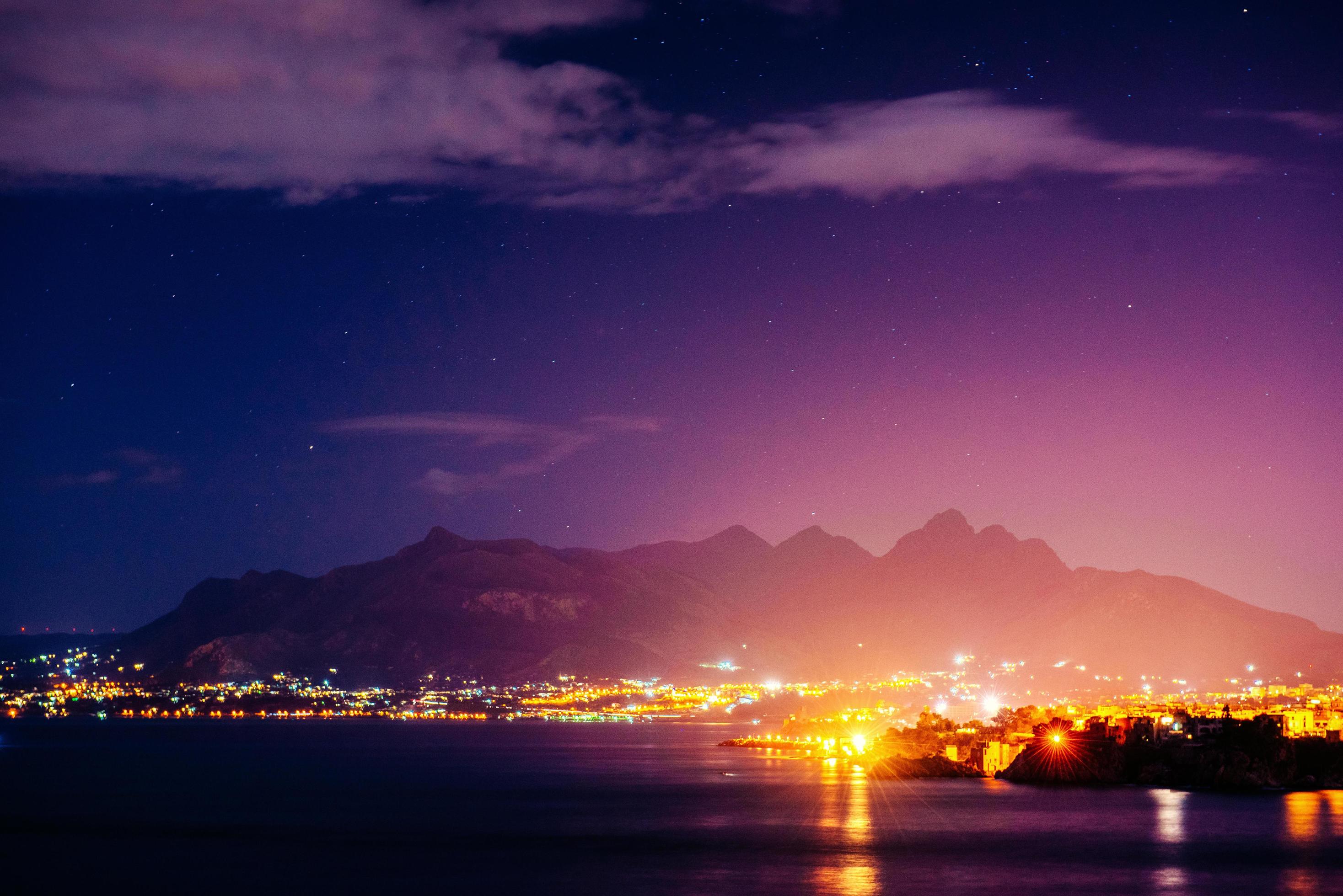 The starry sky above rocky mountains. Stock Free