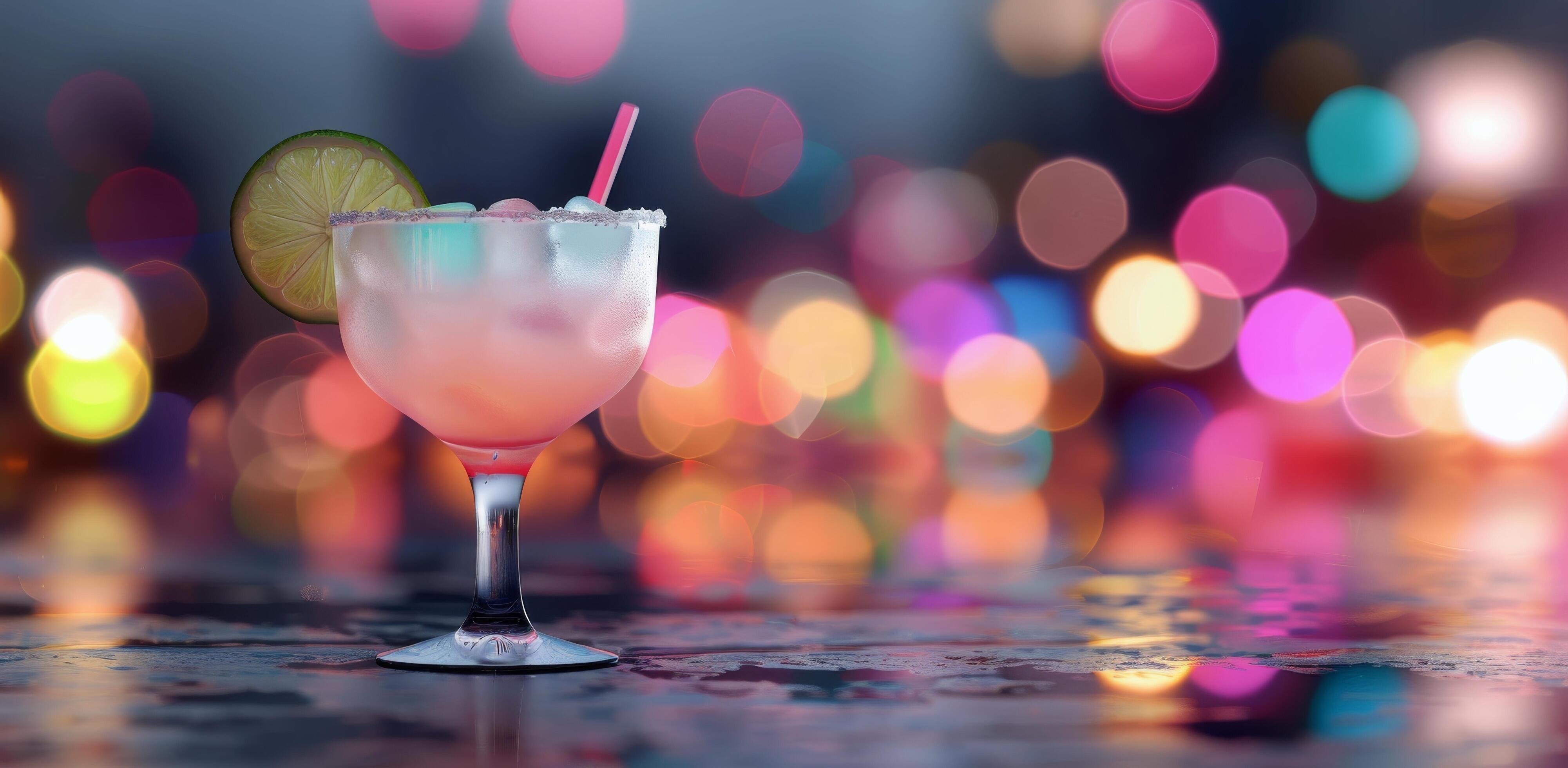 Refreshing Cocktail With Lemon Garnish Against Colorful Bokeh Background Stock Free