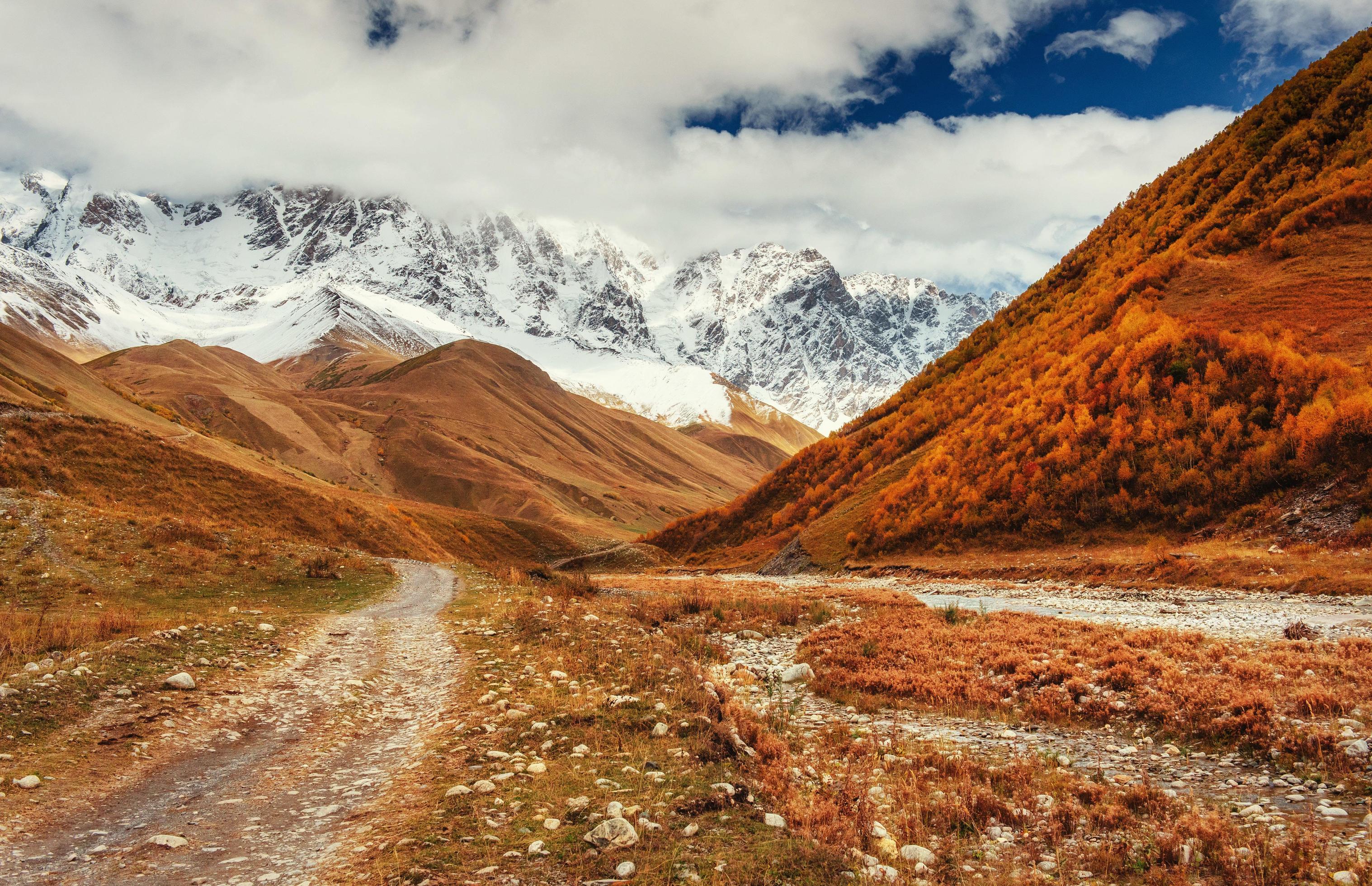 Mountain landscape of snow-capped mountains in the mist Stock Free