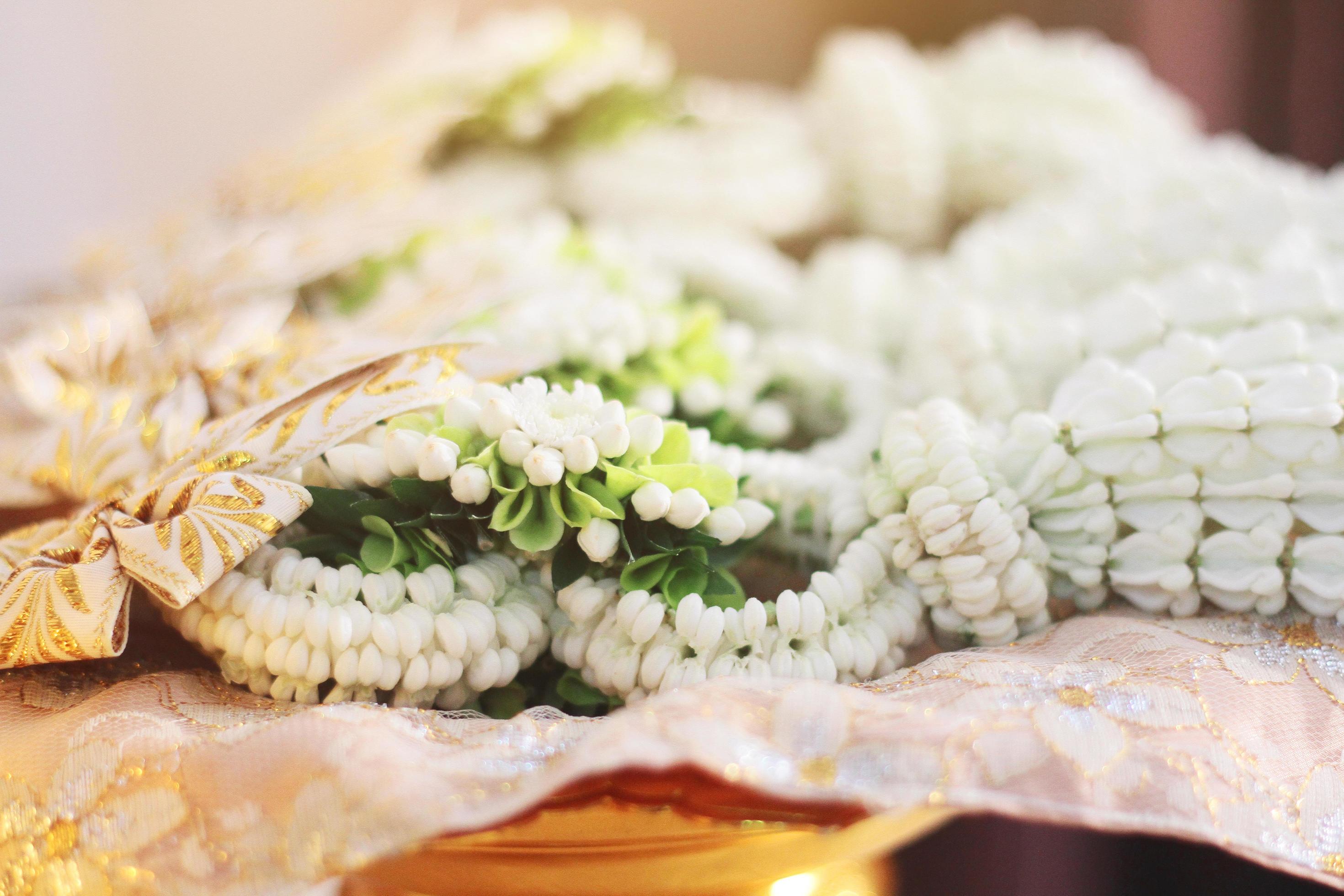 Flower garlands on a gold tray in tradition Thai wedding ceremony day. Jasmine garland. Stock Free