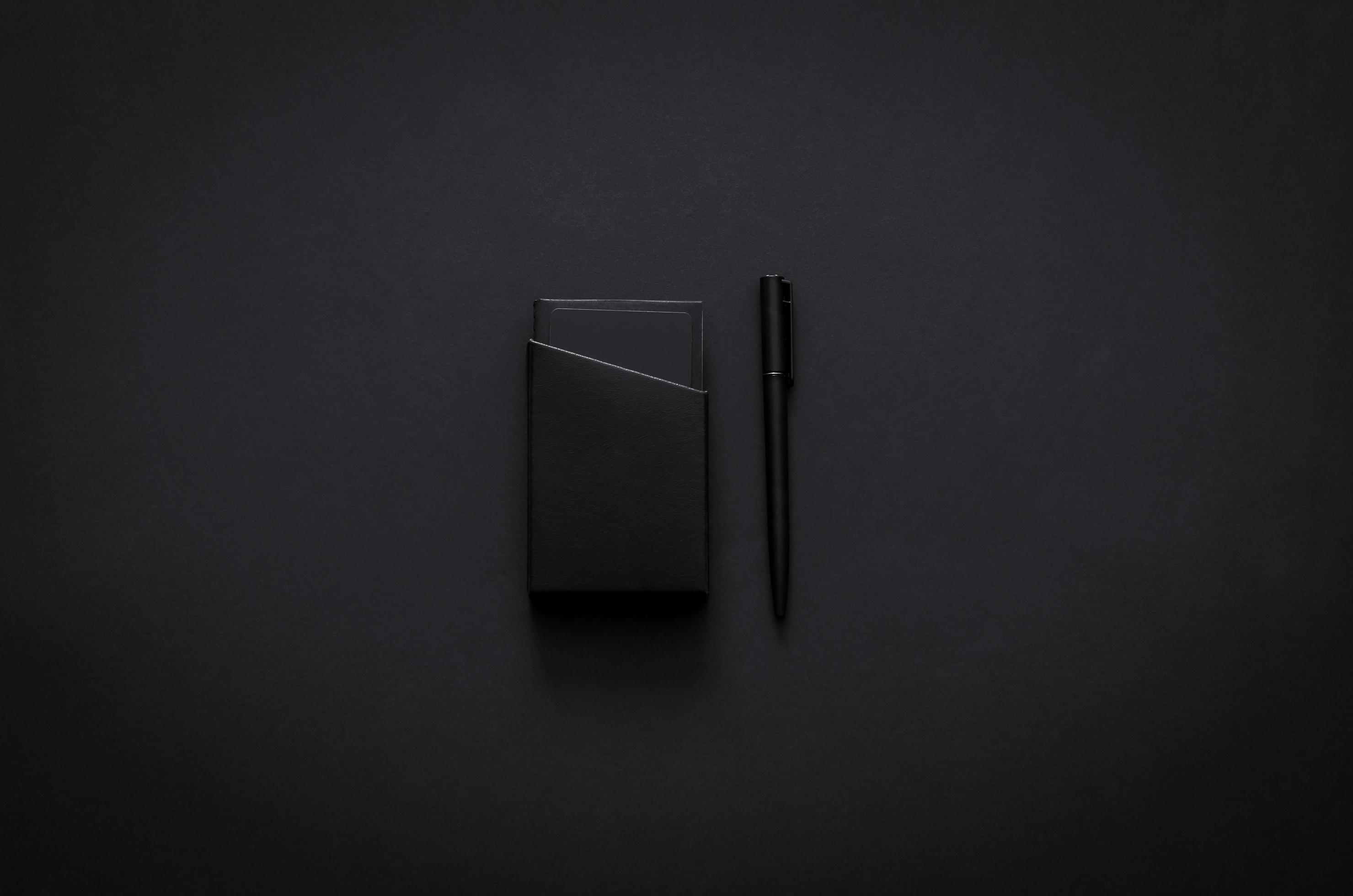 Name card box and pen in modern lifestyle on dark background for minimalist flat lay black concept. Stock Free