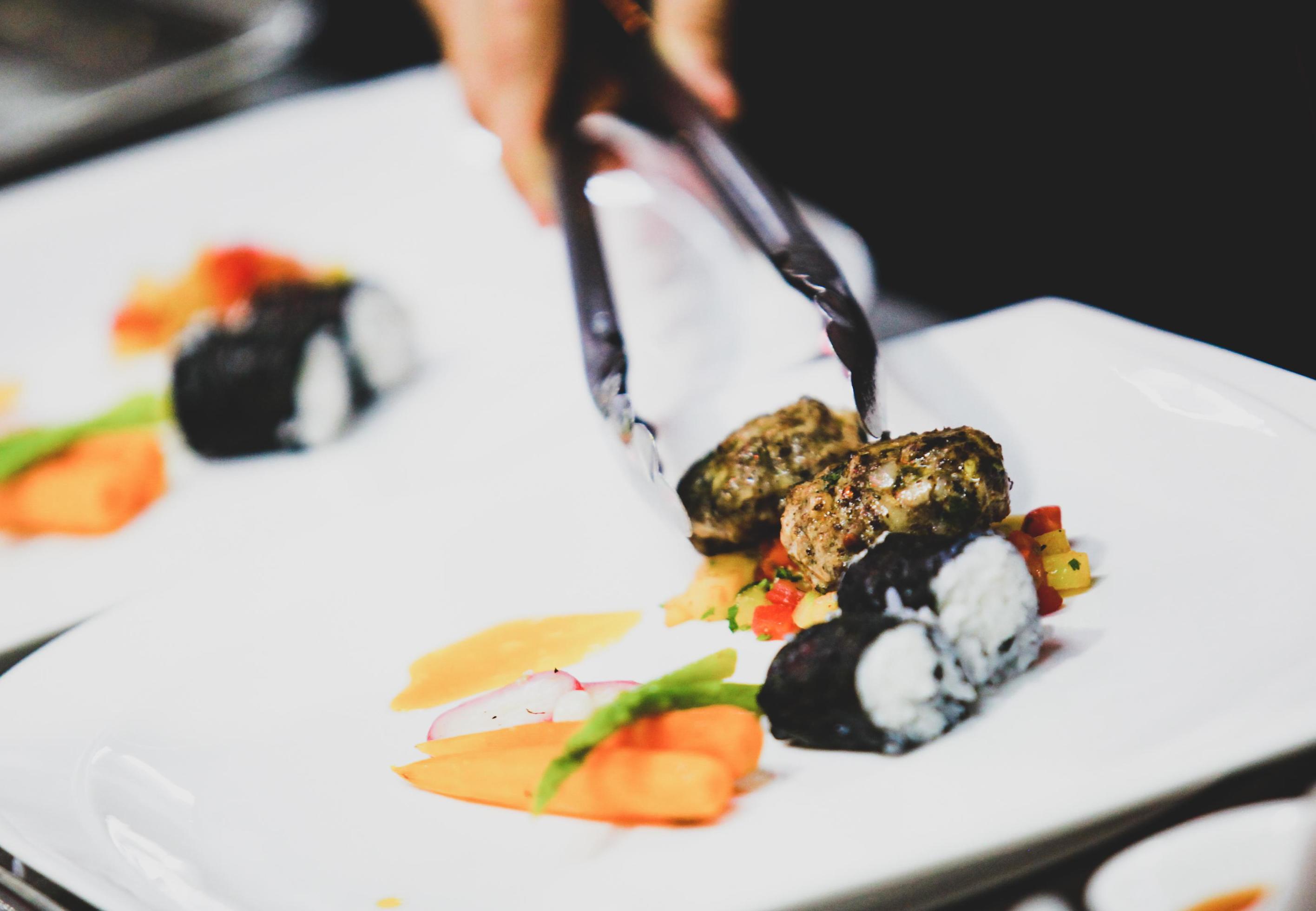 Chef preparing food in the kitchen, chef cooking, Chef decorating dish Stock Free