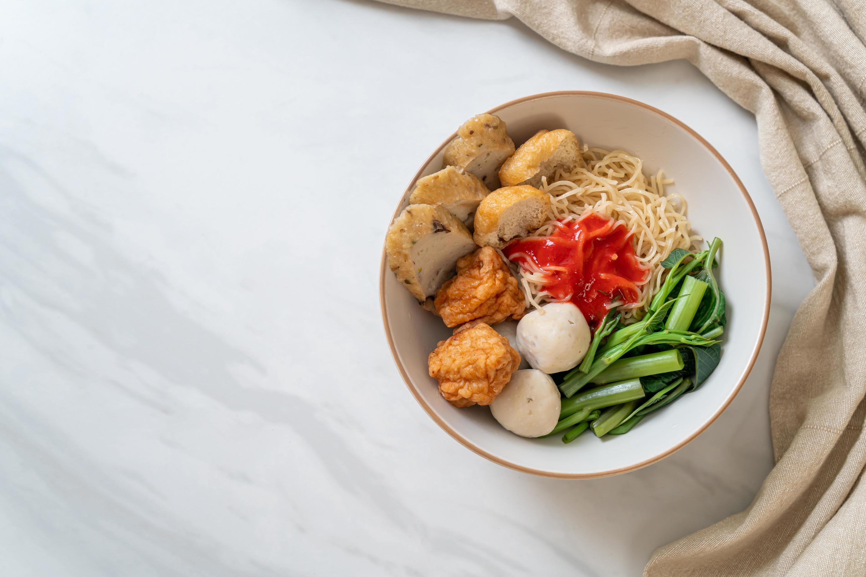 Egg noodles with fish balls and shrimp balls in pink sauce, Yen Ta Four or Yen Ta Fo – Asian food style Stock Free