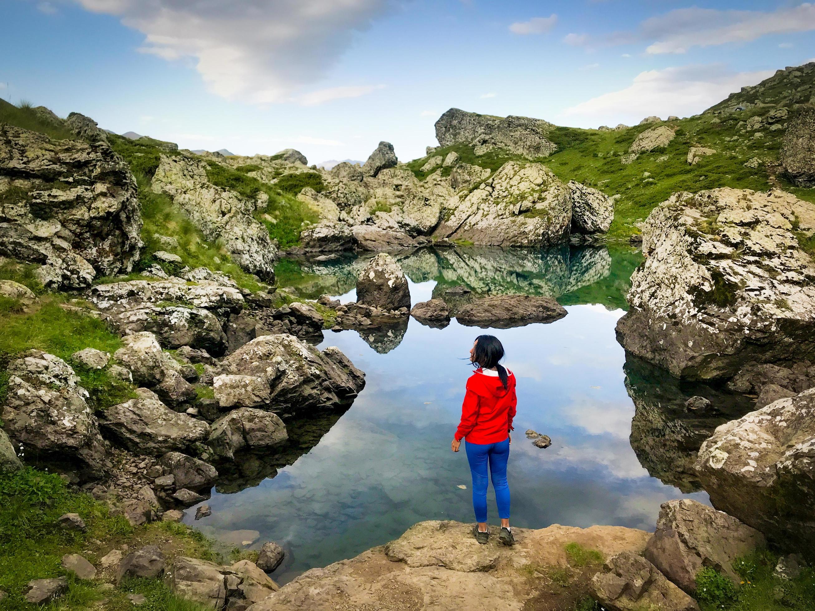 Woman stand by lake outdoors in nature Stock Free