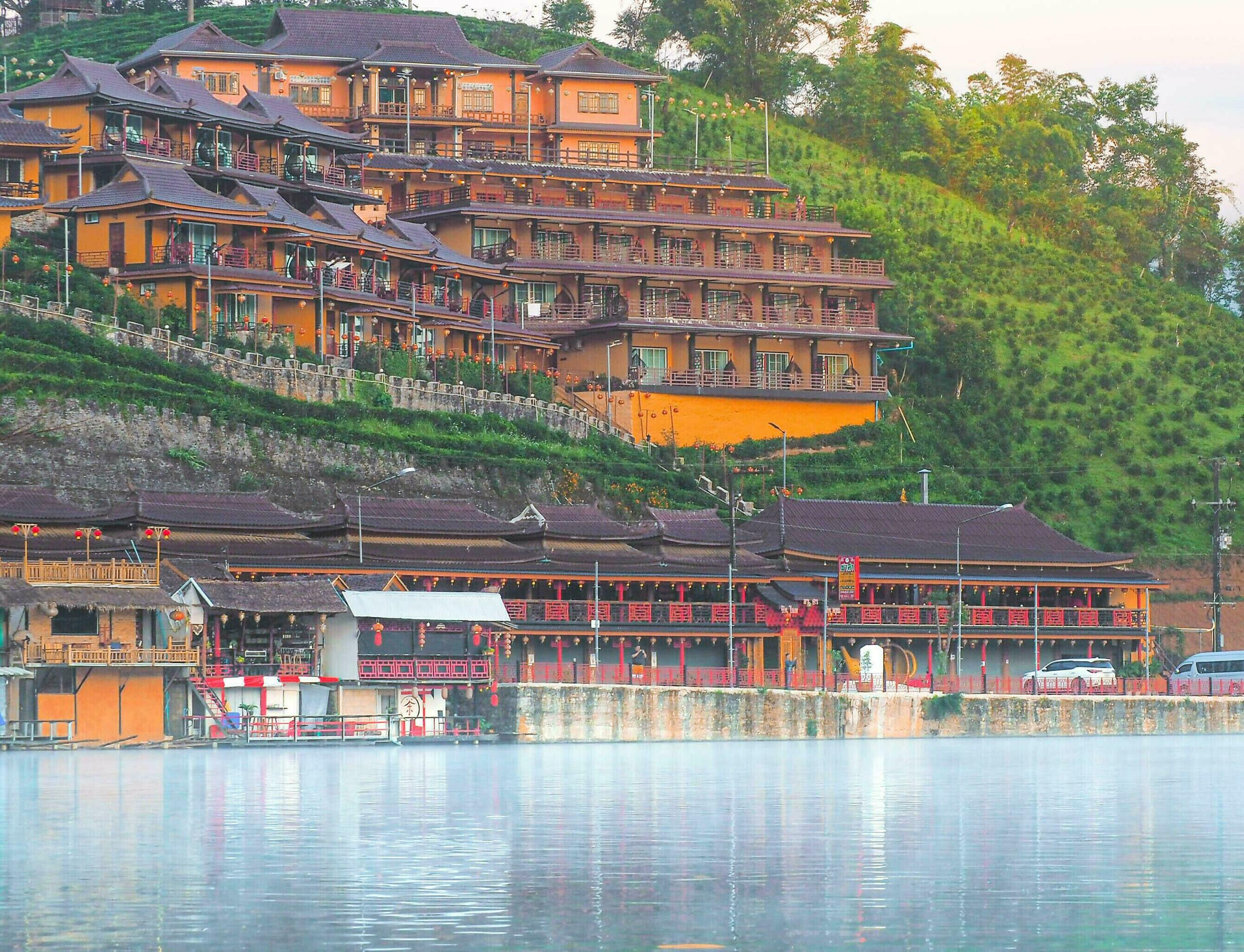 Chinese boat launched early in the morning at Rak Thai hamlet in Maehongson, Thailand, on the lake with water vapor, Banrakthai, Ban rak thai. Stock Free