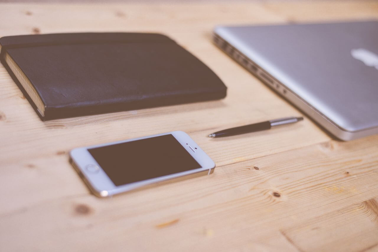 IPhone and MacBook on Wooden Desk Stock Free