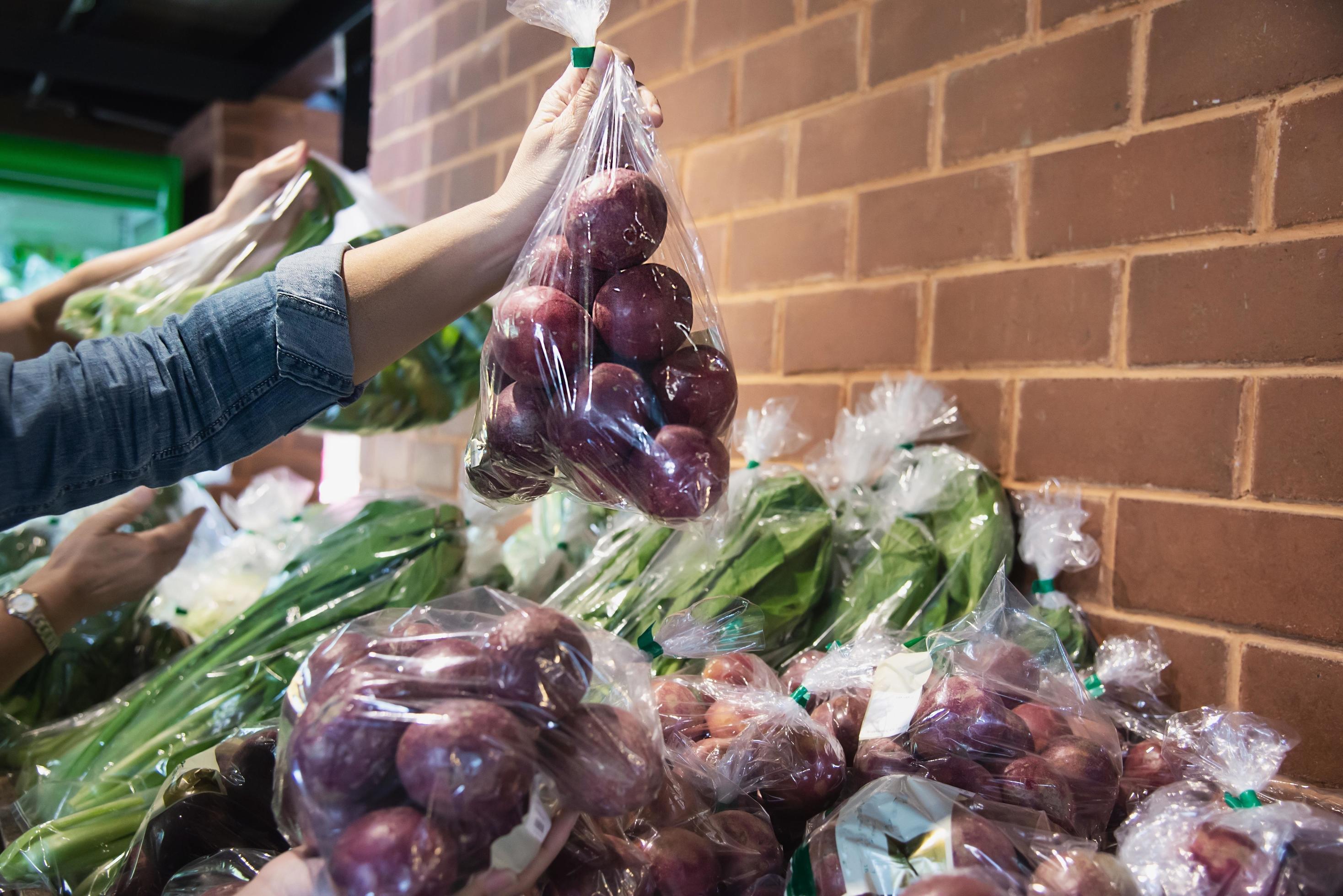 Lady is shopping fresh vegetable in supermarket store – woman in fresh market lifestyle concept Stock Free