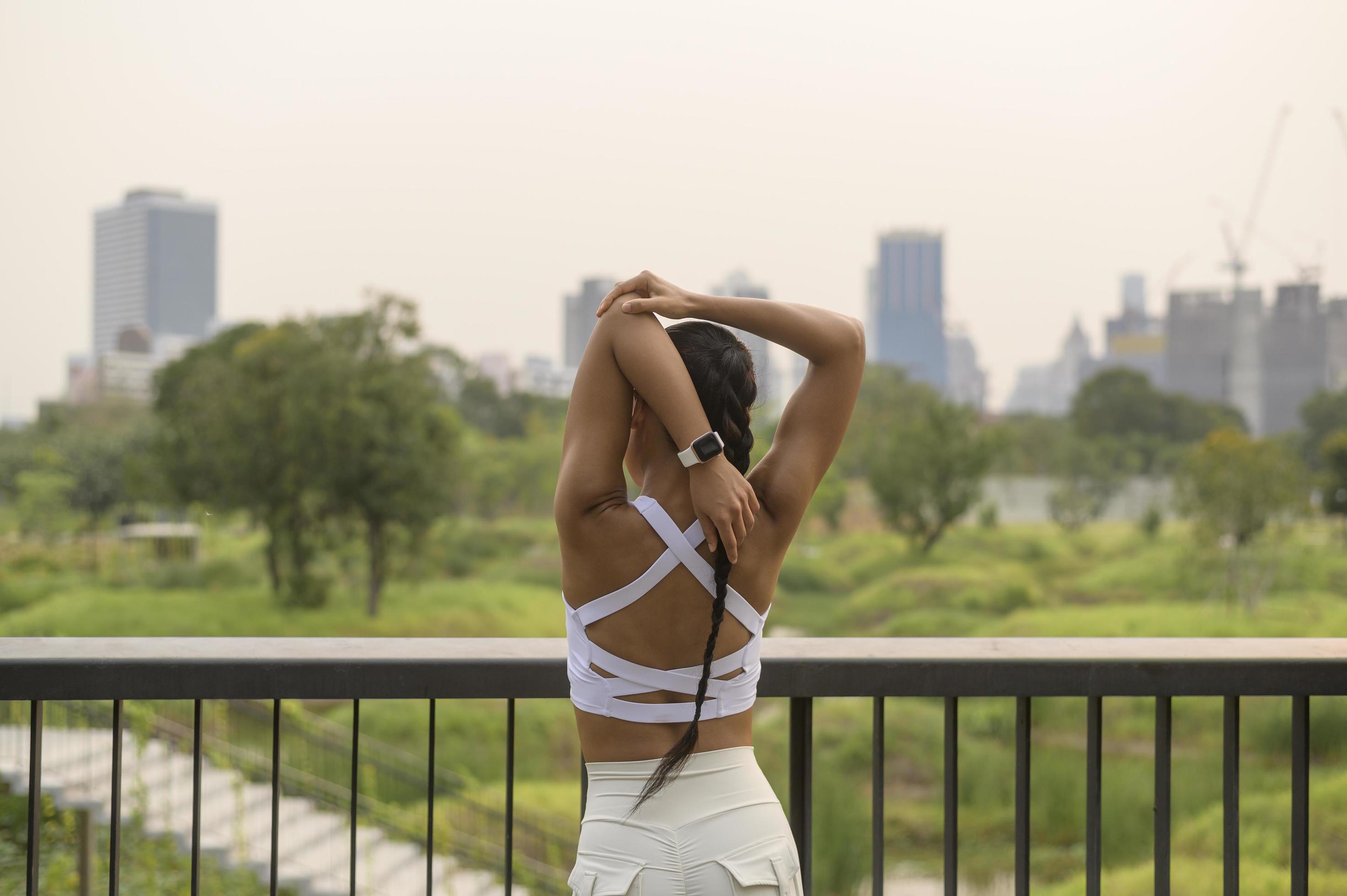 A young fitness woman in sportswear exercising in city park, Healthy and Lifestyles. Stock Free