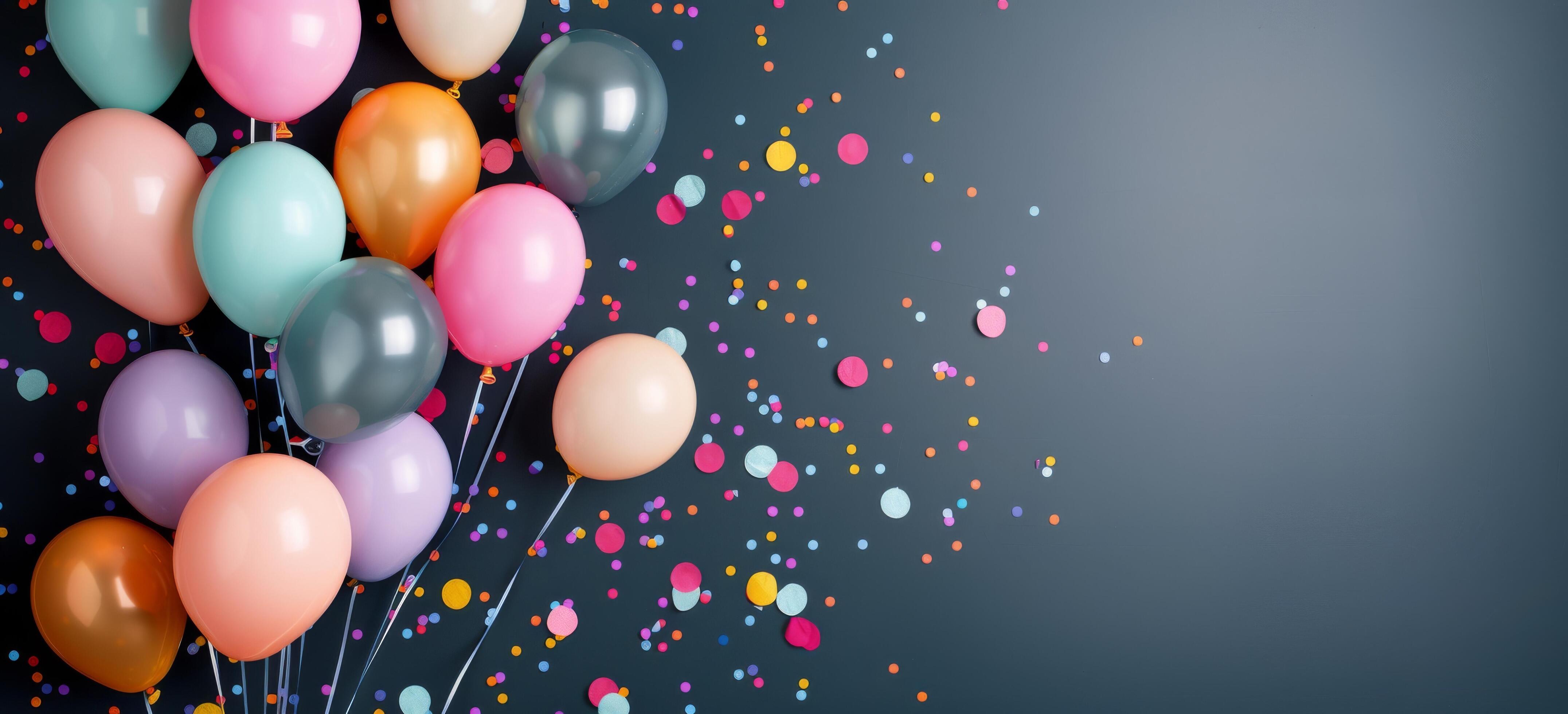 Colorful Balloons and Confetti on a Dark Background Stock Free