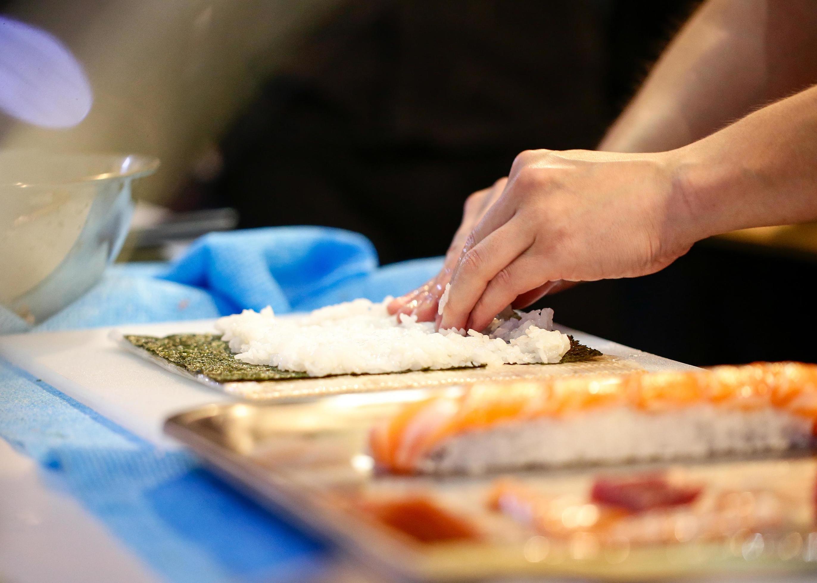 chef hands preparing japanese food, chef making sushi Stock Free