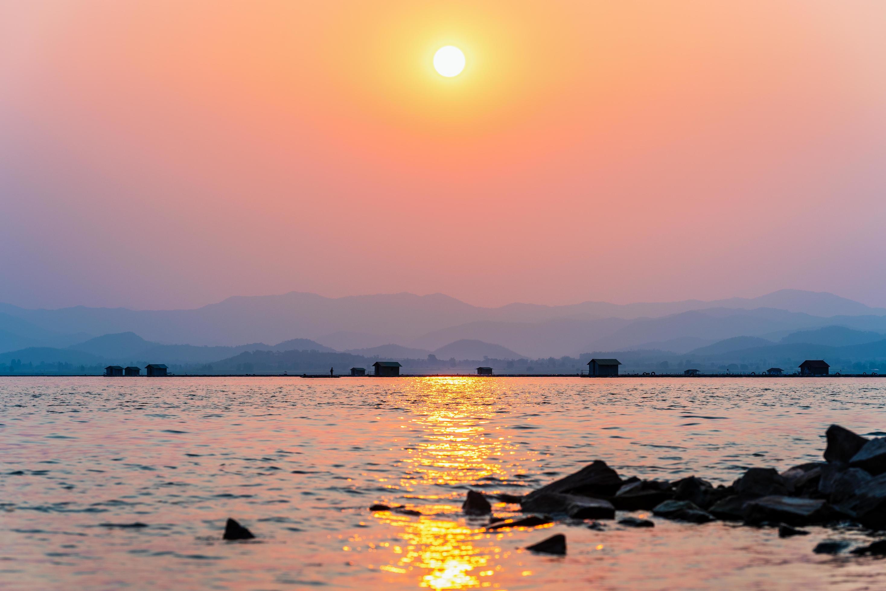 Fisherman in a boat fishing in a rural lifestyle Stock Free