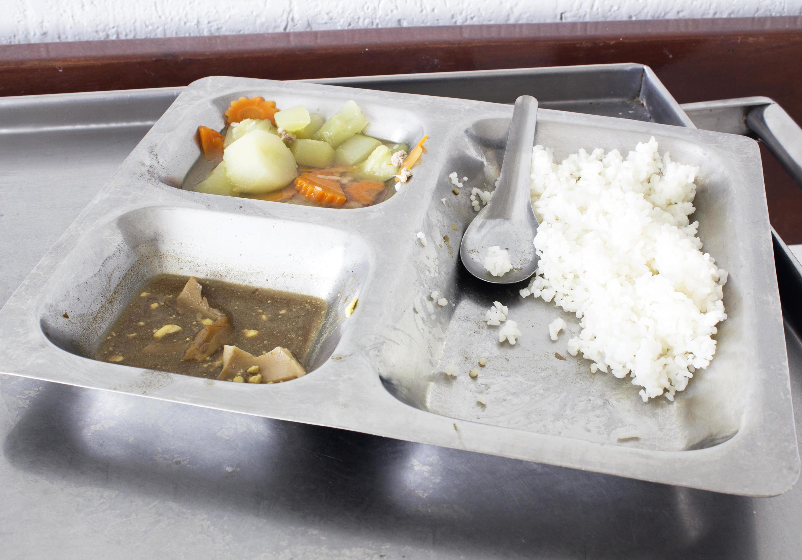 Leftover food in aluminum tray . Stock Free