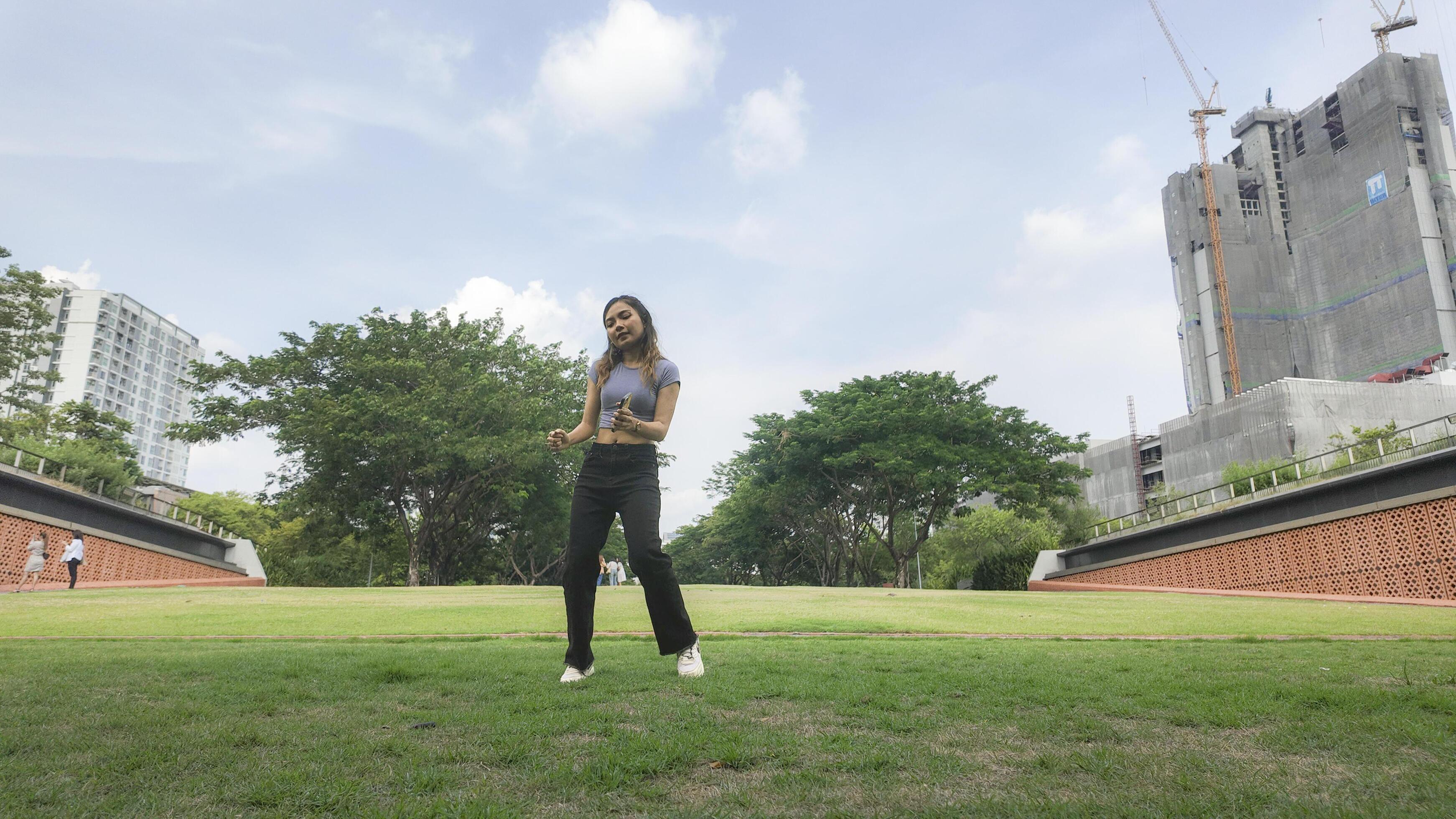 
									Asian women do freestyle hip hop and breakdancing in a public space in the middle of the city. With a cheerful and happy attitude Stock Free