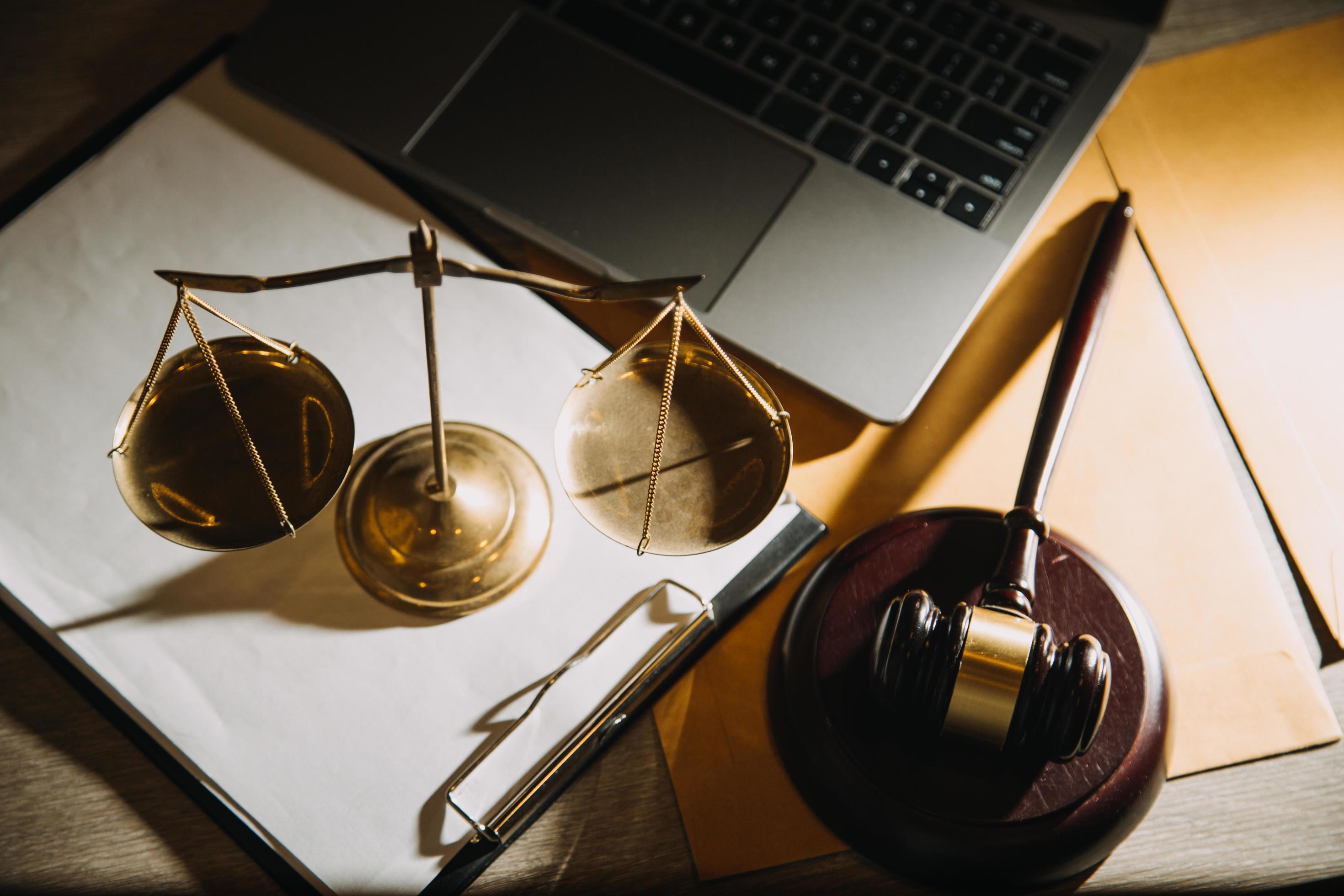 Business and lawyers discussing contract papers with brass scale on desk in office. Law, legal services, advice, justice and law concept Stock Free