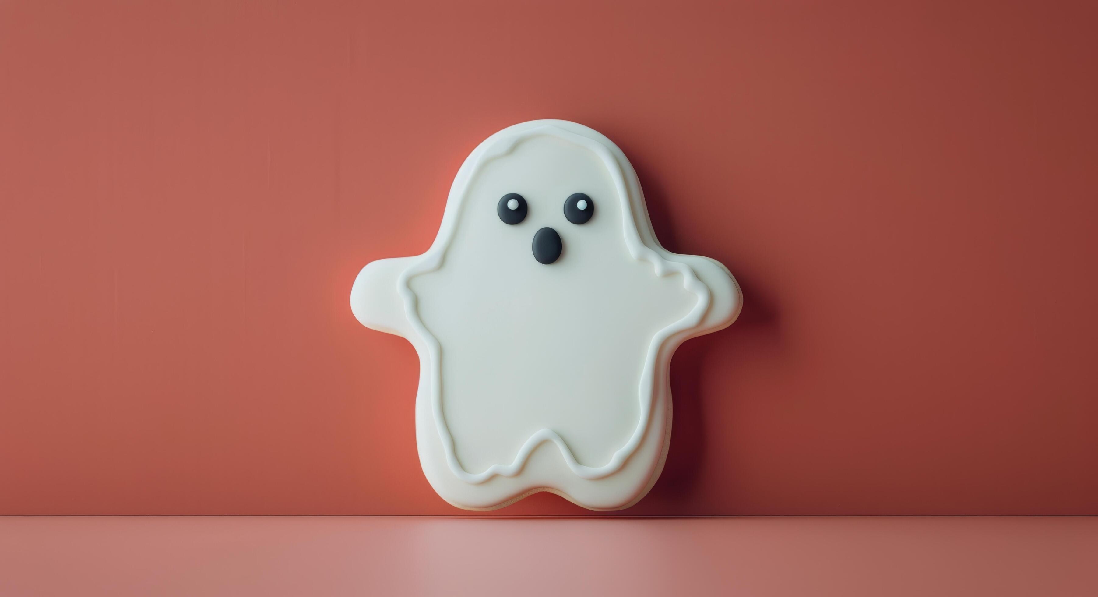 Cute Ghost-Shaped Cookie on Red Background for Halloween Celebration Stock Free