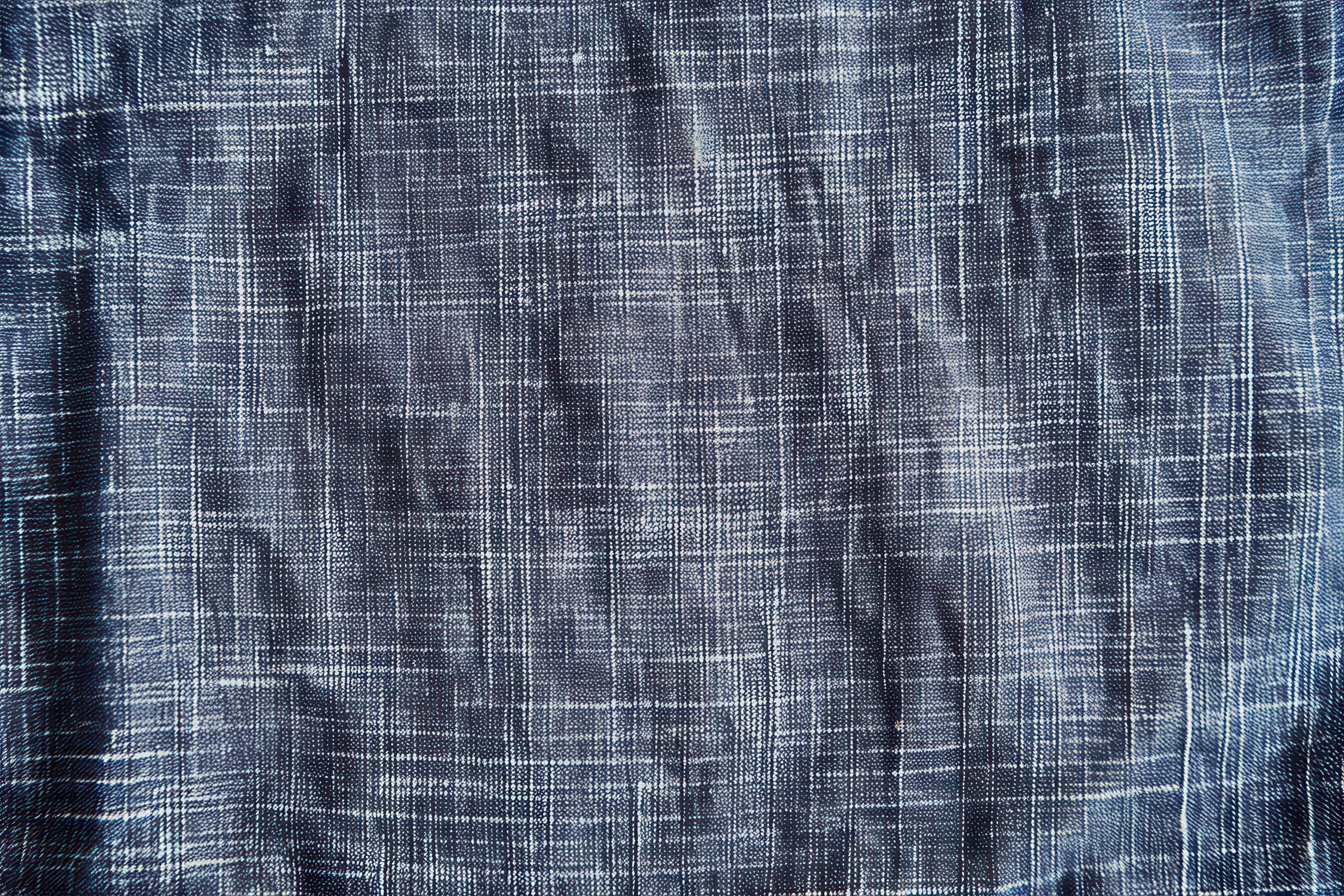 A chambray texture background features a soft, subtle weave with a classic, casual appeal Stock Free