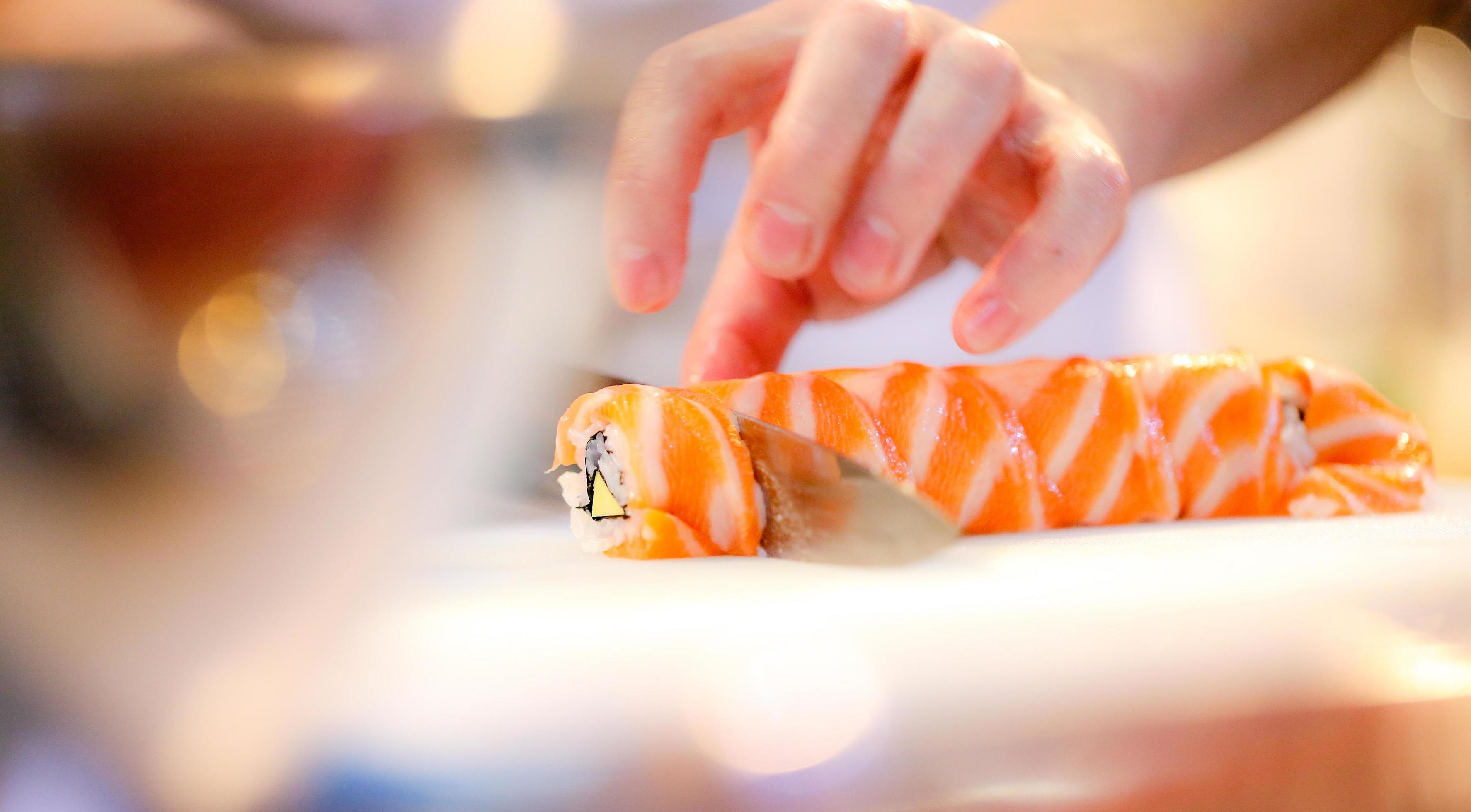 chef hands preparing japanese food, chef making sushi Stock Free