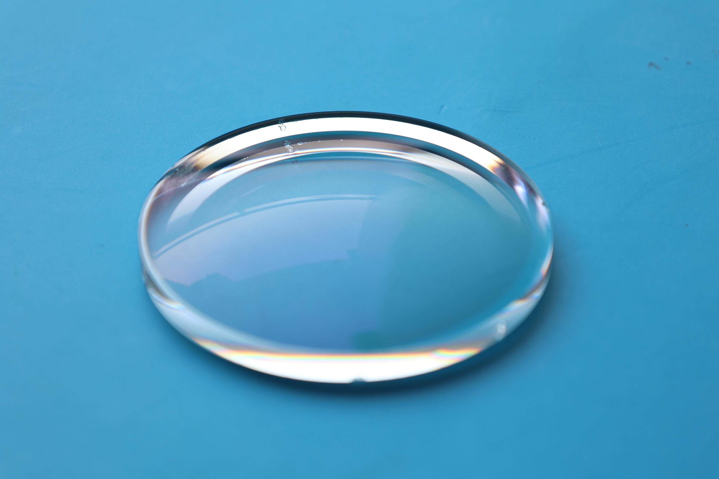 Eyeglasses lens production industry, close-up eyeglasses lenses, eyeglasses lenses, eyeglasses lenses, eyeglasses store business concept Stock Free