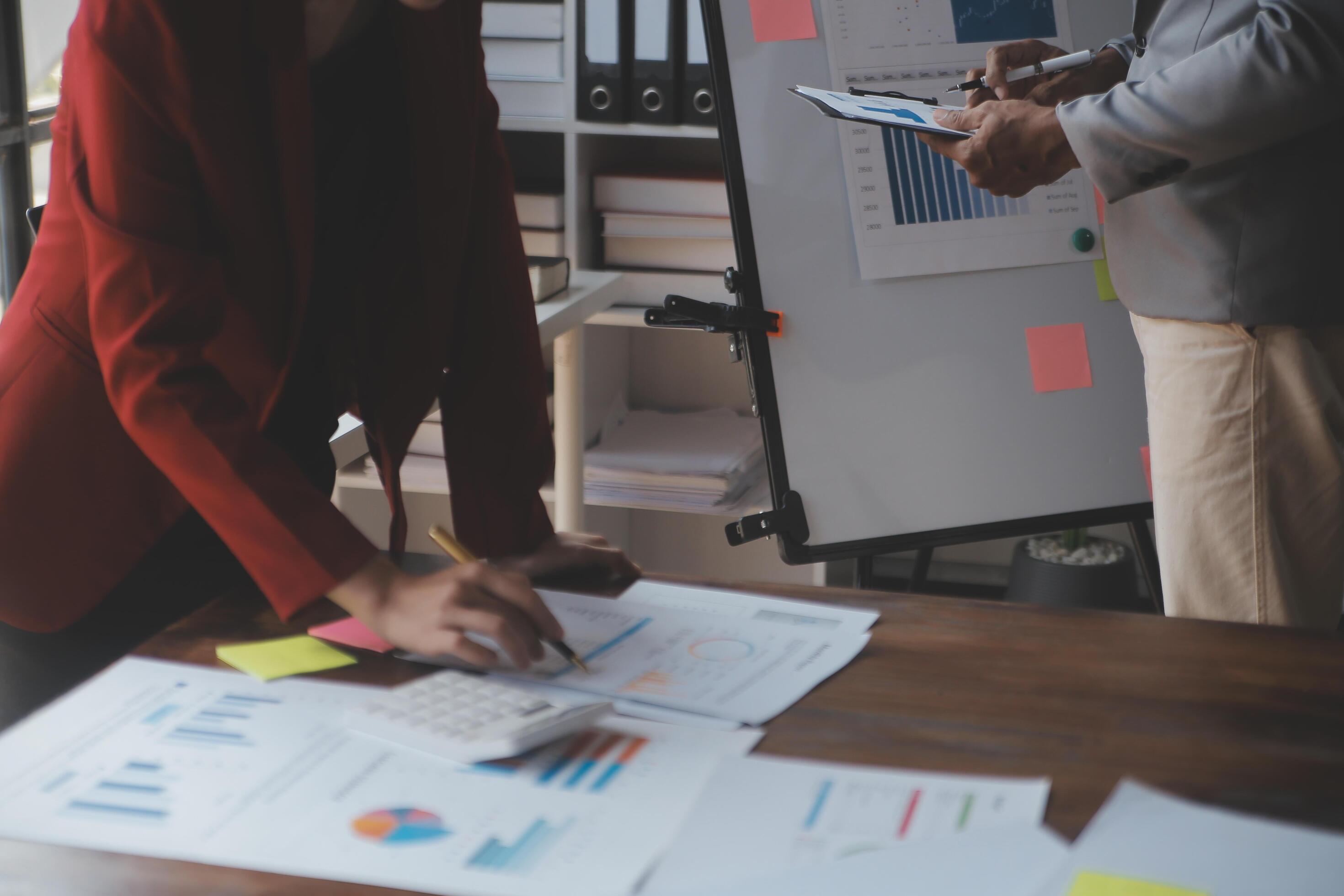 Close up of Business team analyzing income charts and graphs with modern laptop computer. Business analysis and strategy concept. Stock Free