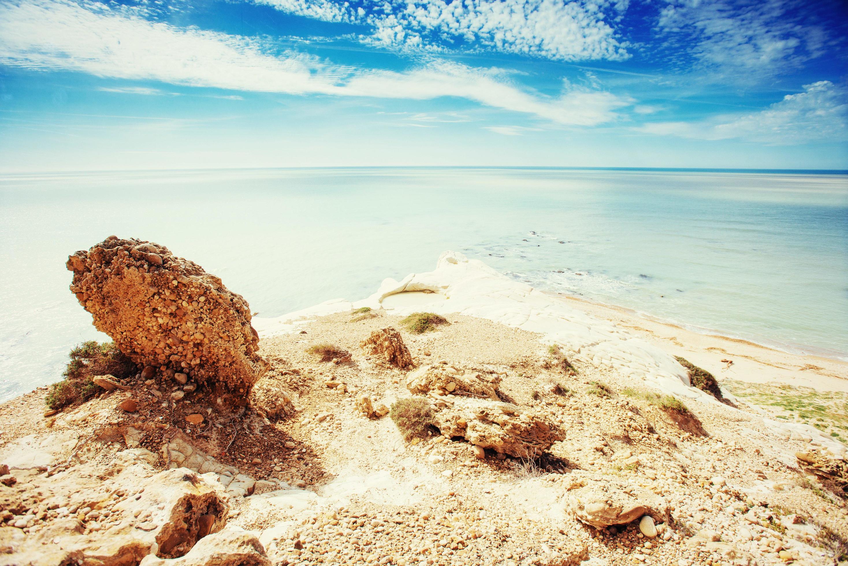 rocky sea coast in the summer. Beauty world Stock Free