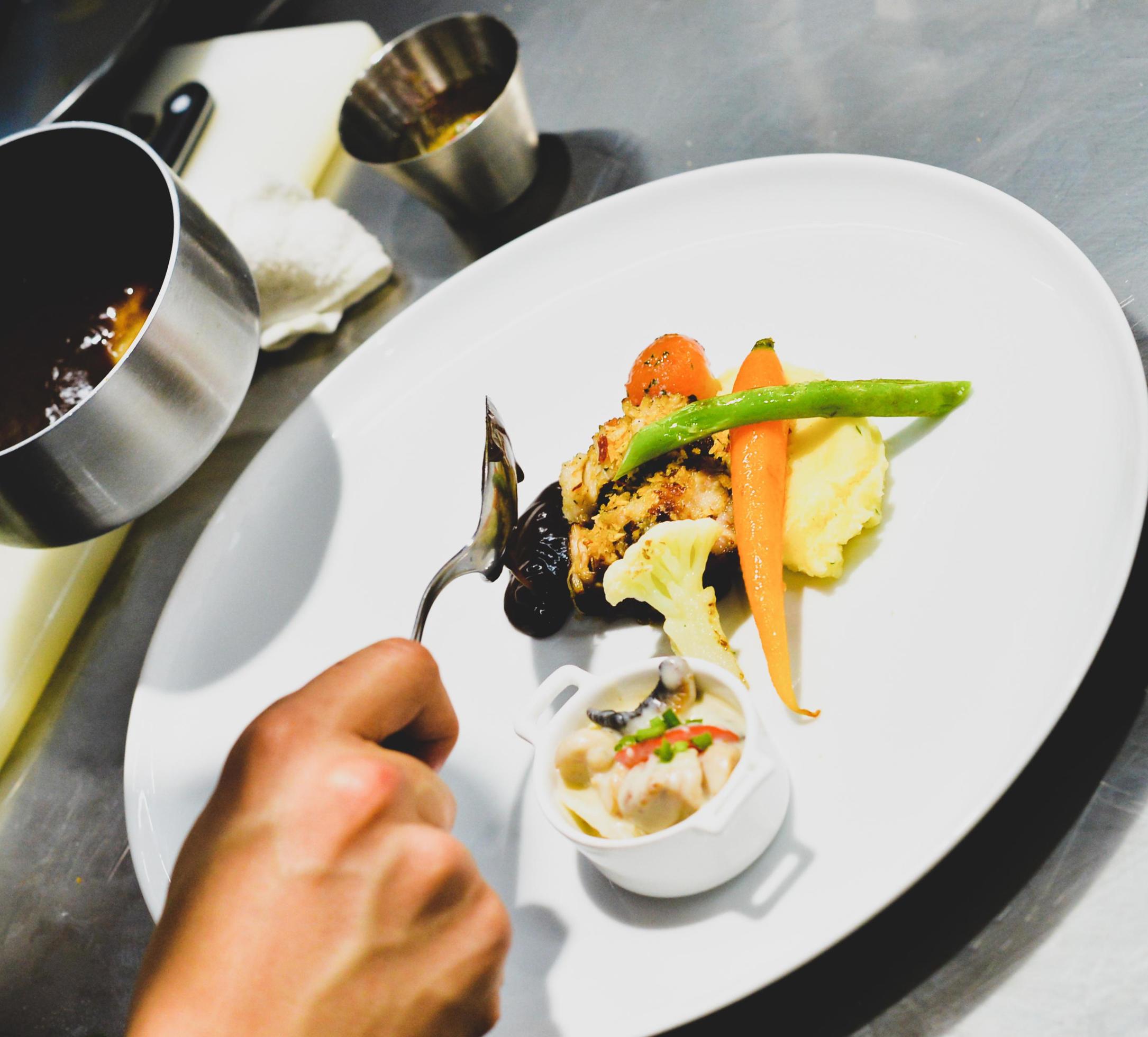 Chef preparing food in the kitchen, chef cooking, Chef decorating dish Stock Free