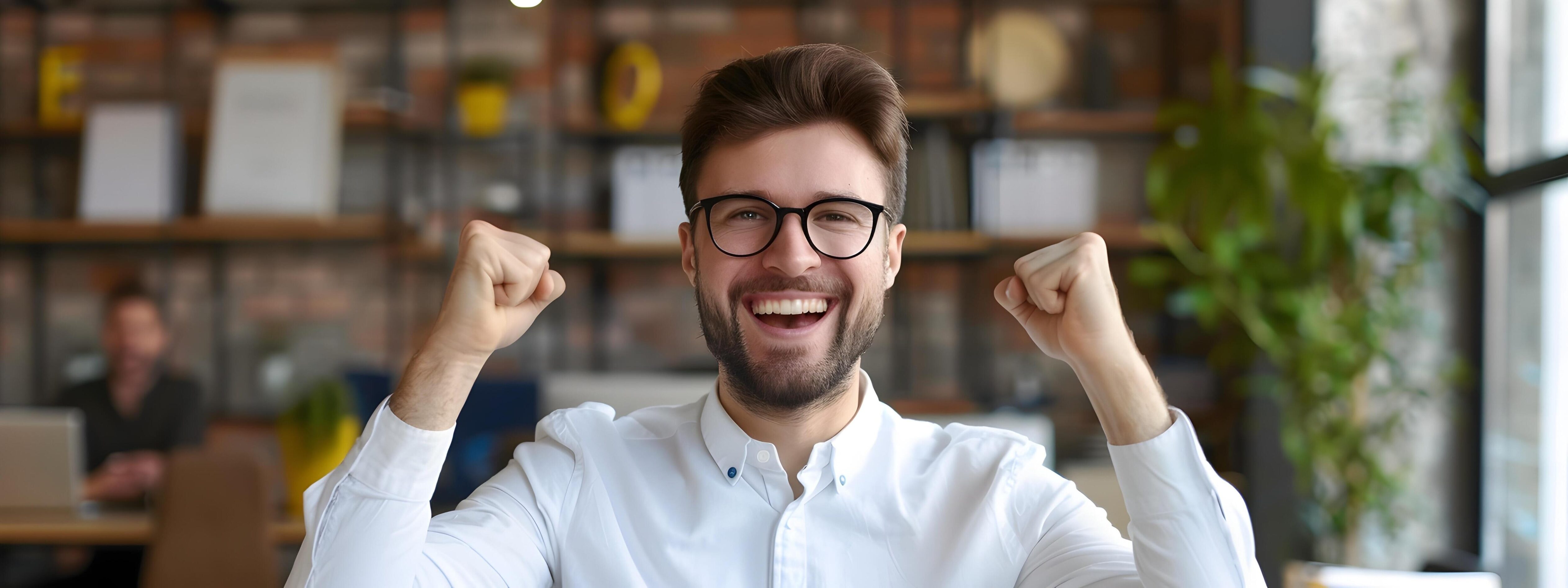 Elated Office Manager Celebrates Accomplishments in Modern Workplace Setting Stock Free