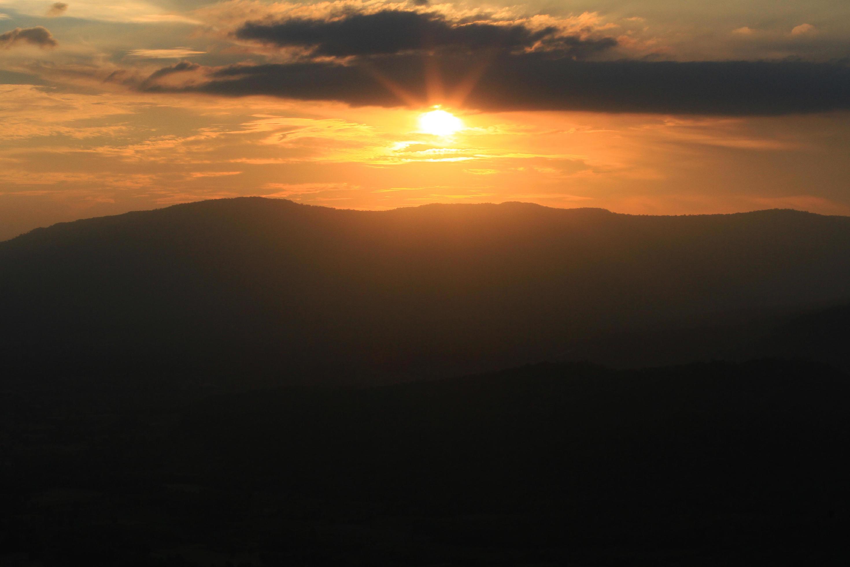 Beautiful landscape layers of mountain and Misty on hill valley in golden twilight of sunset at Thailand Stock Free