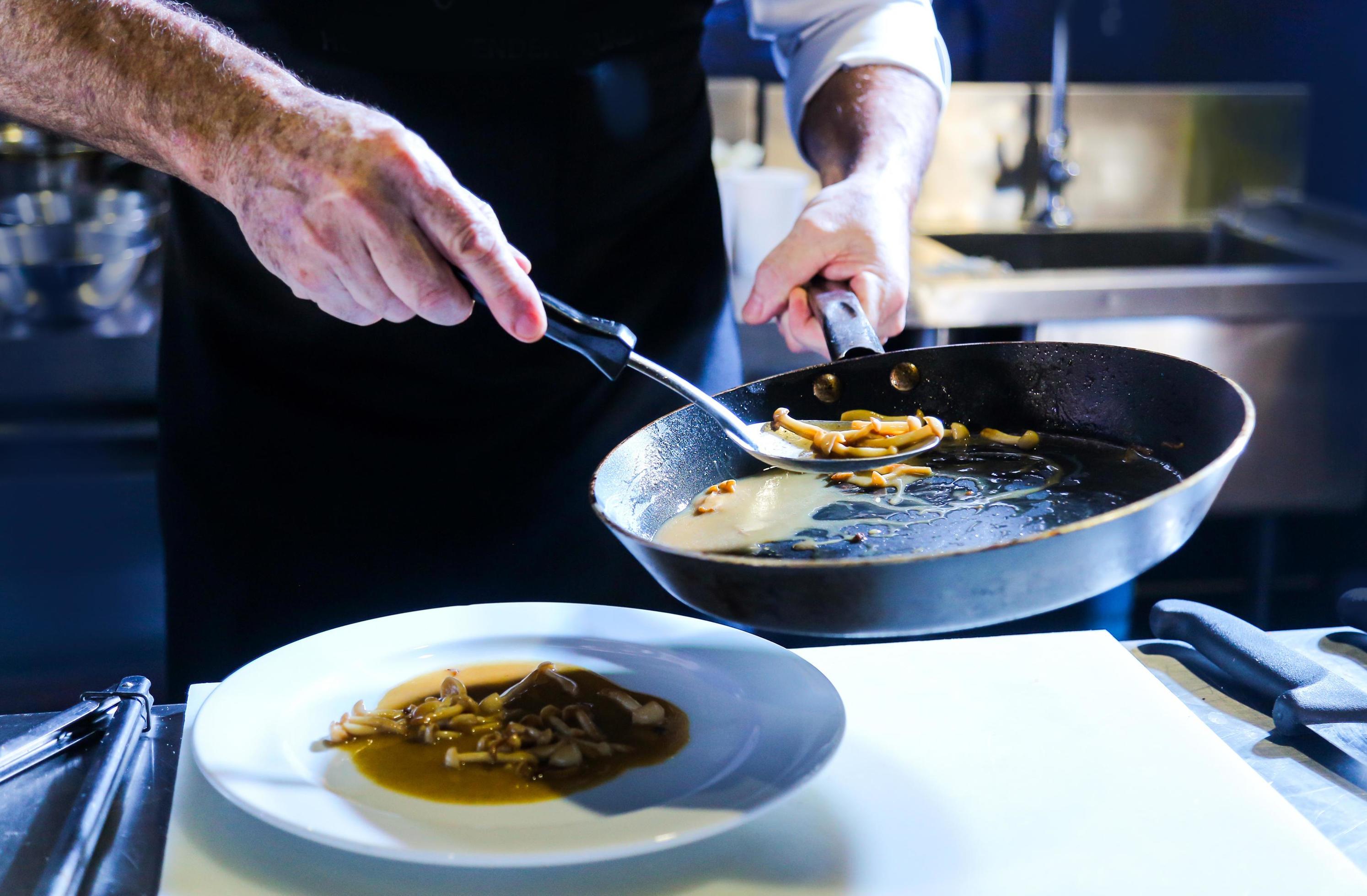 Chef preparing food in the kitchen, chef cooking, closeup Stock Free