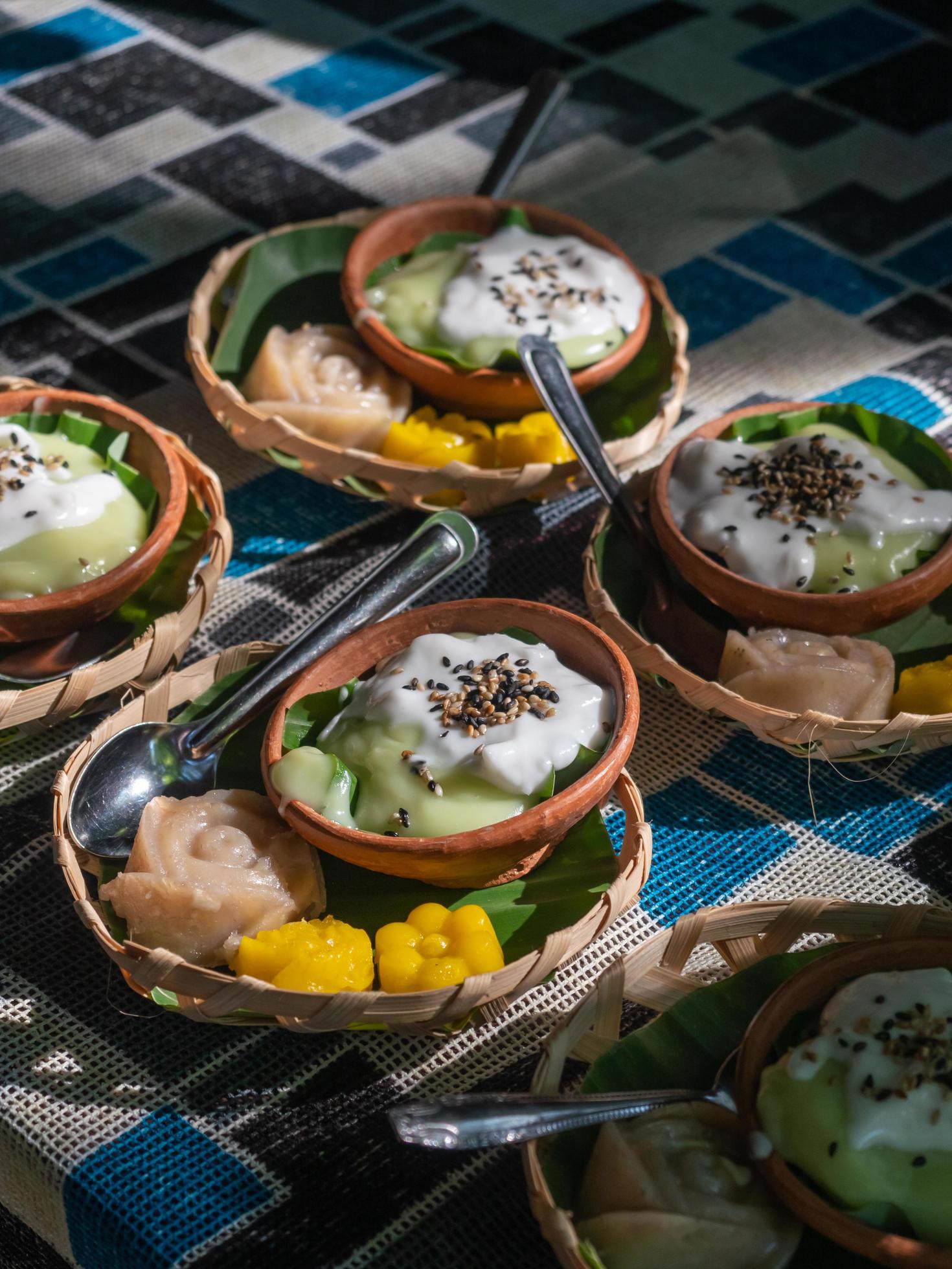 ThaiVarious Thai desserts in a small bamboo basket. Food on the table. Stock Free