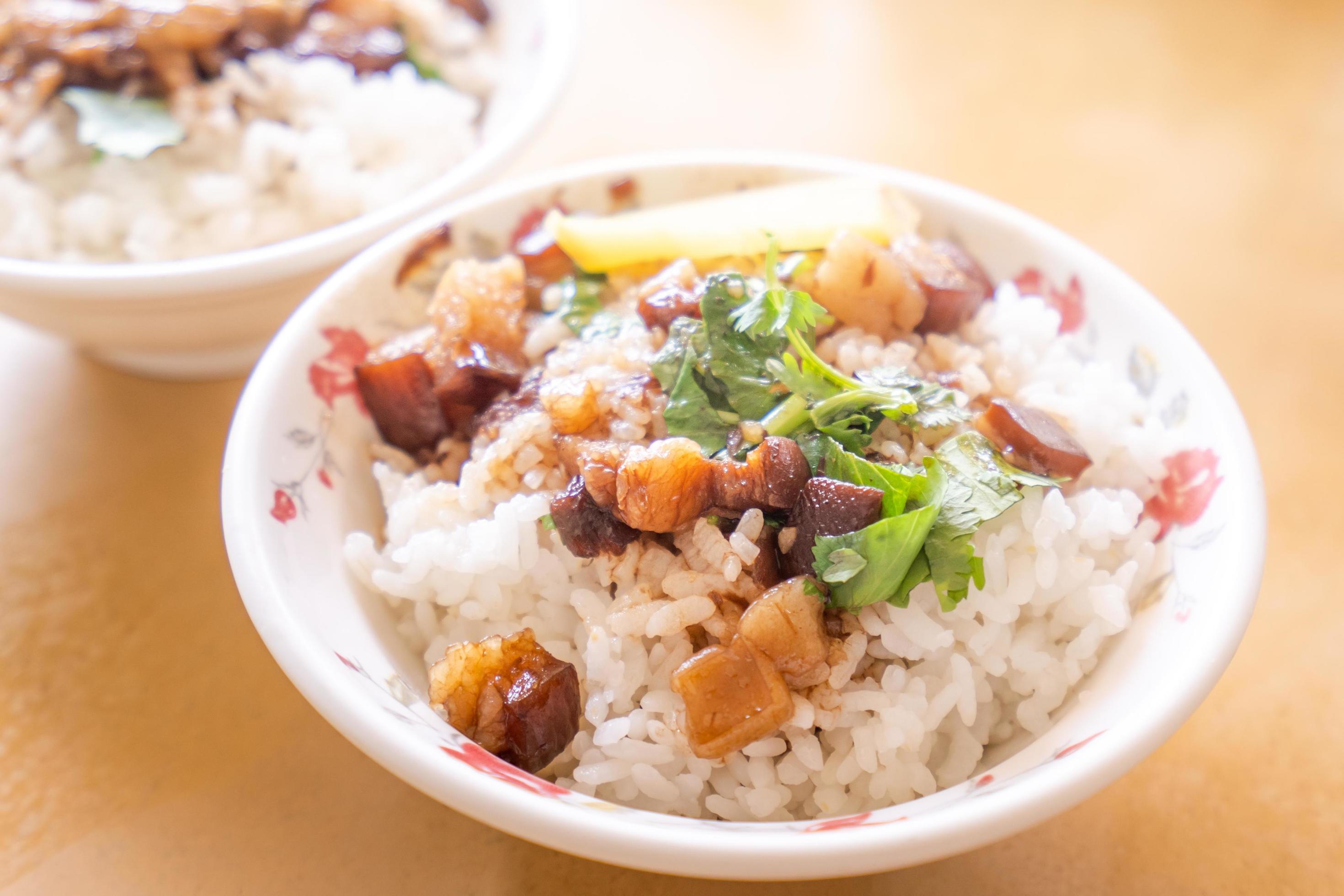 Braised pork over rice – Taiwan famous traditional street food delicacy. Soy-stewed pork on rice. Travel design concept. Top view,copy space,close up Stock Free