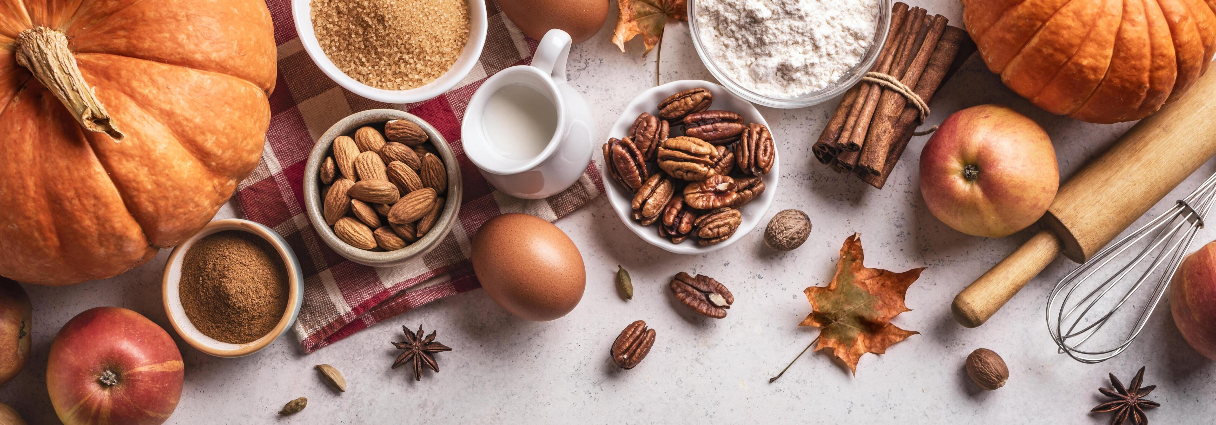 Autumn baking background with pumpkins, apples and nuts Stock Free