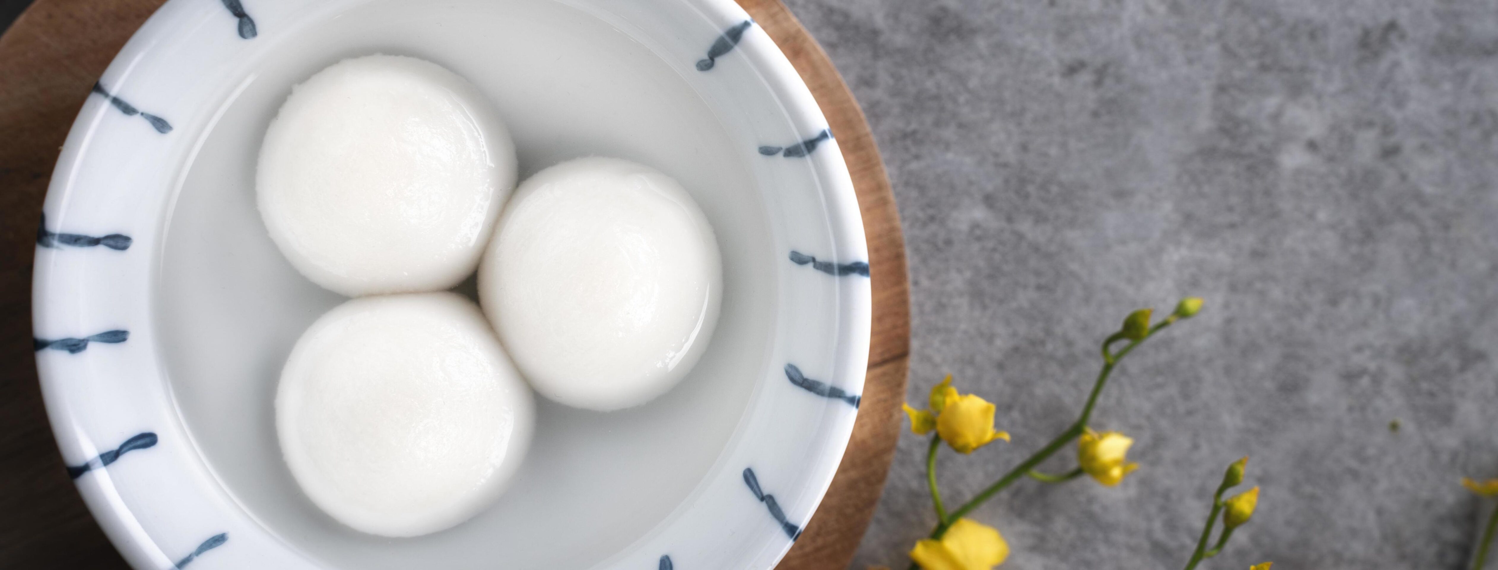 Top view of big tangyuan yuanxiao in a bowl on gray background for lunar new year food. Stock Free