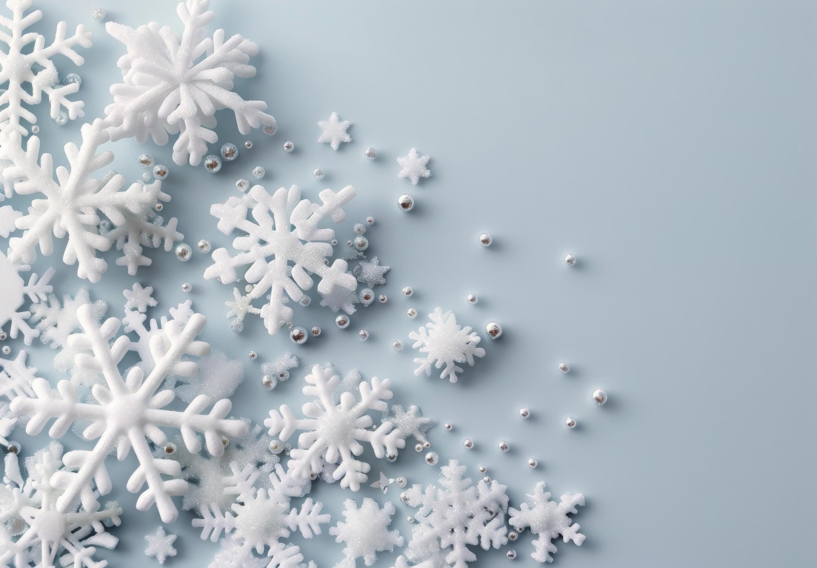 White Snowflakes and Beads on Soft Blue Background for Winter Decor Stock Free