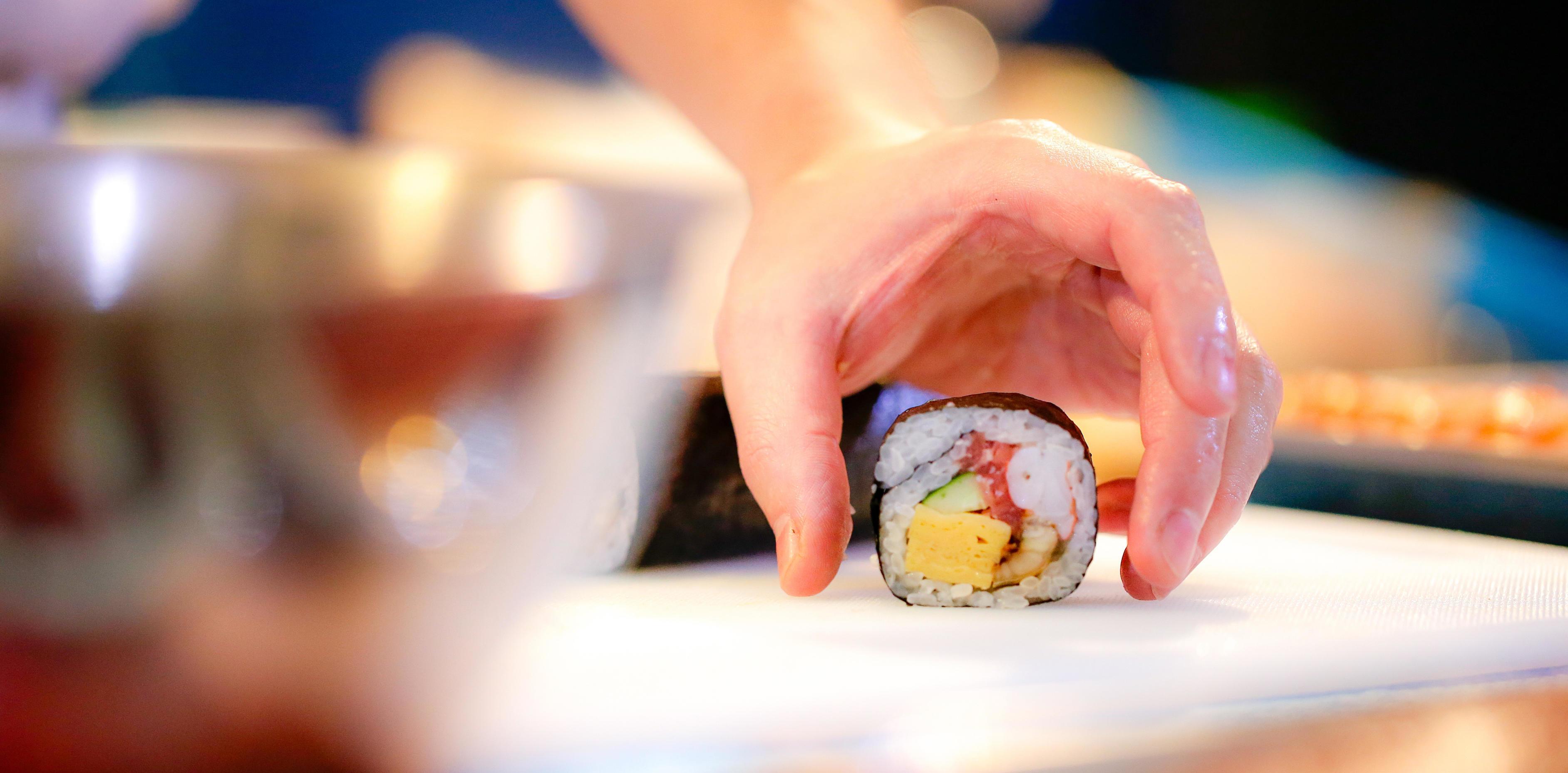 chef hands preparing japanese food, chef making sushi Stock Free