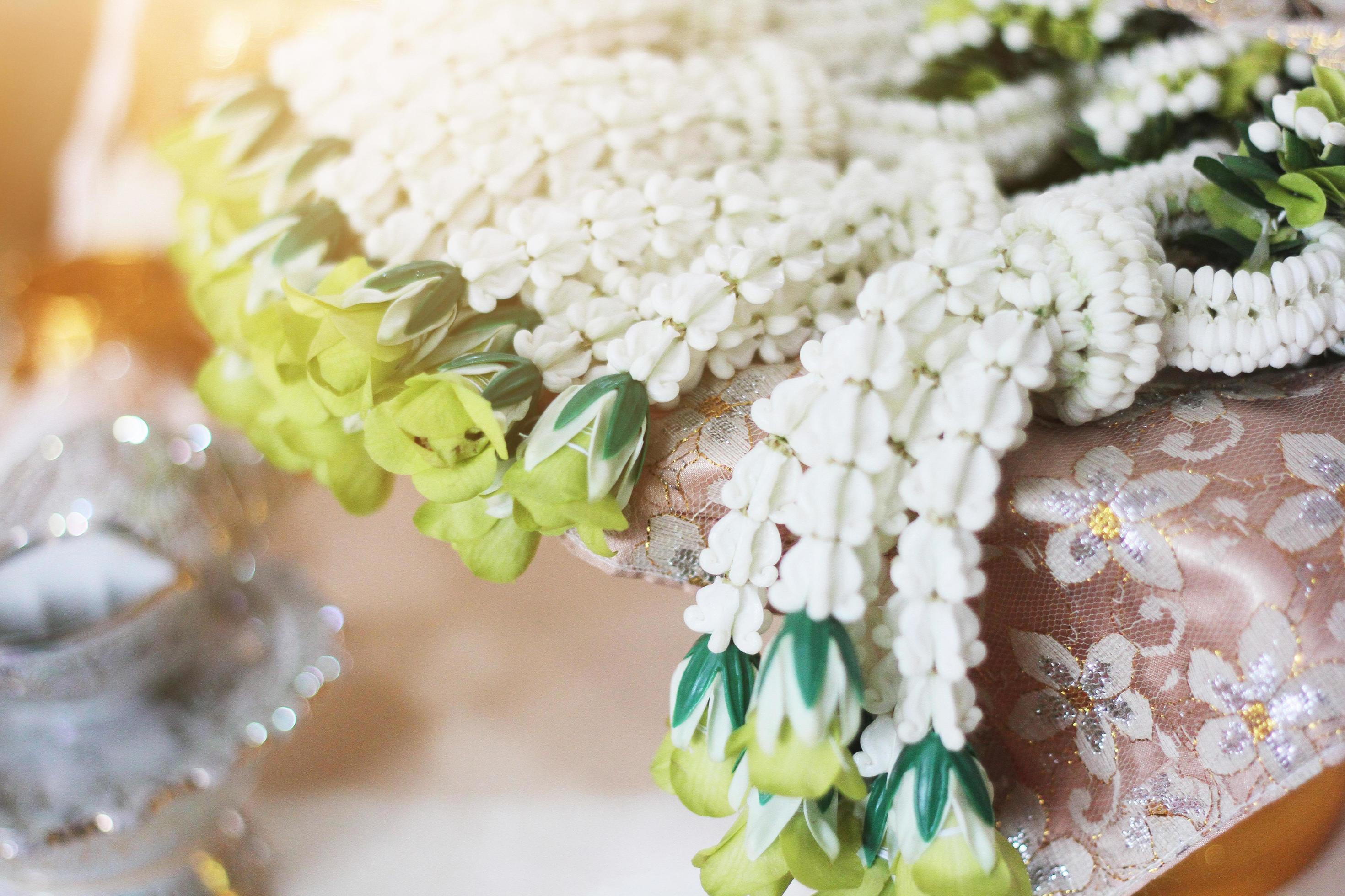 Flower garlands on a gold tray in tradition Thai wedding ceremony day. Jasmine garland Stock Free