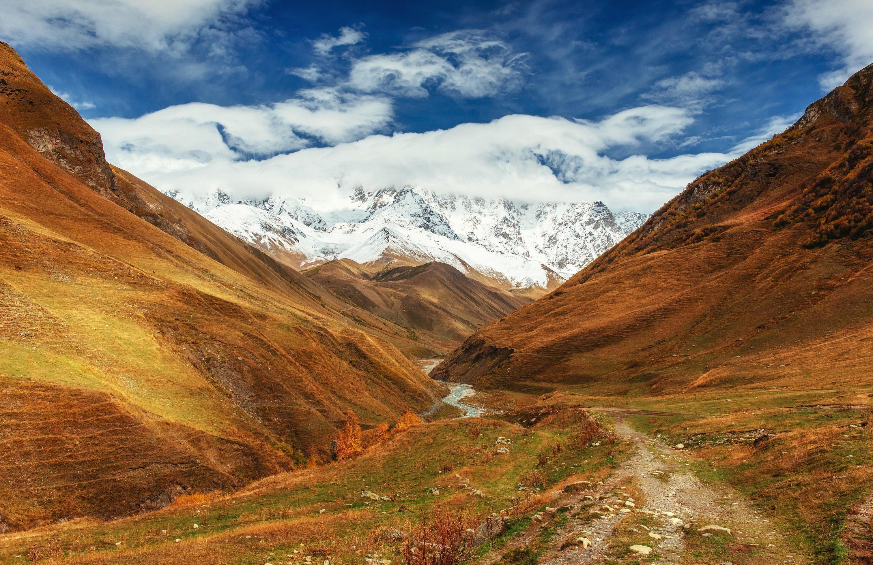 Mountain landscape of snow-capped mountains in the mist Stock Free