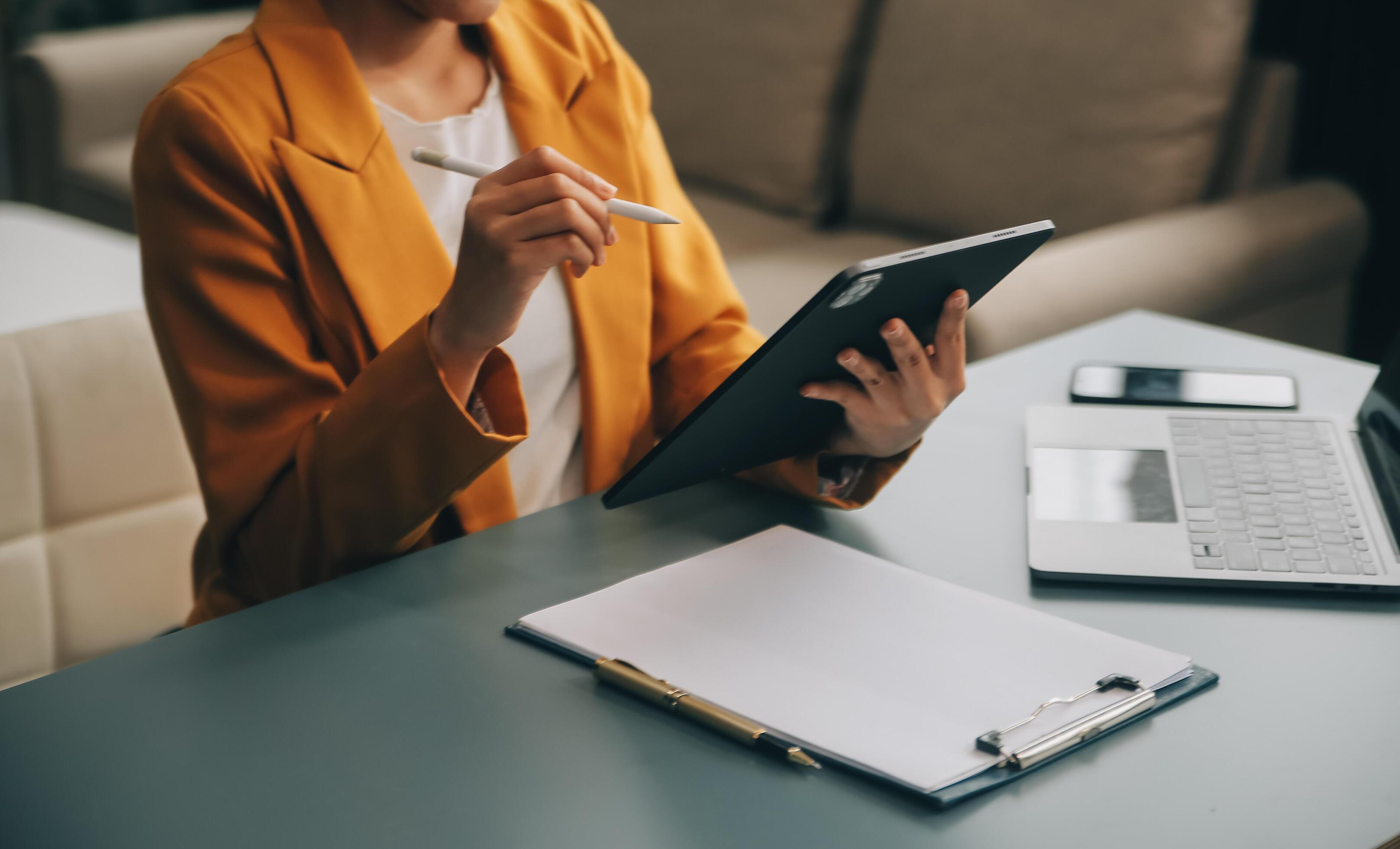 Portrait of a successful business woman using digital tablet Stock Free