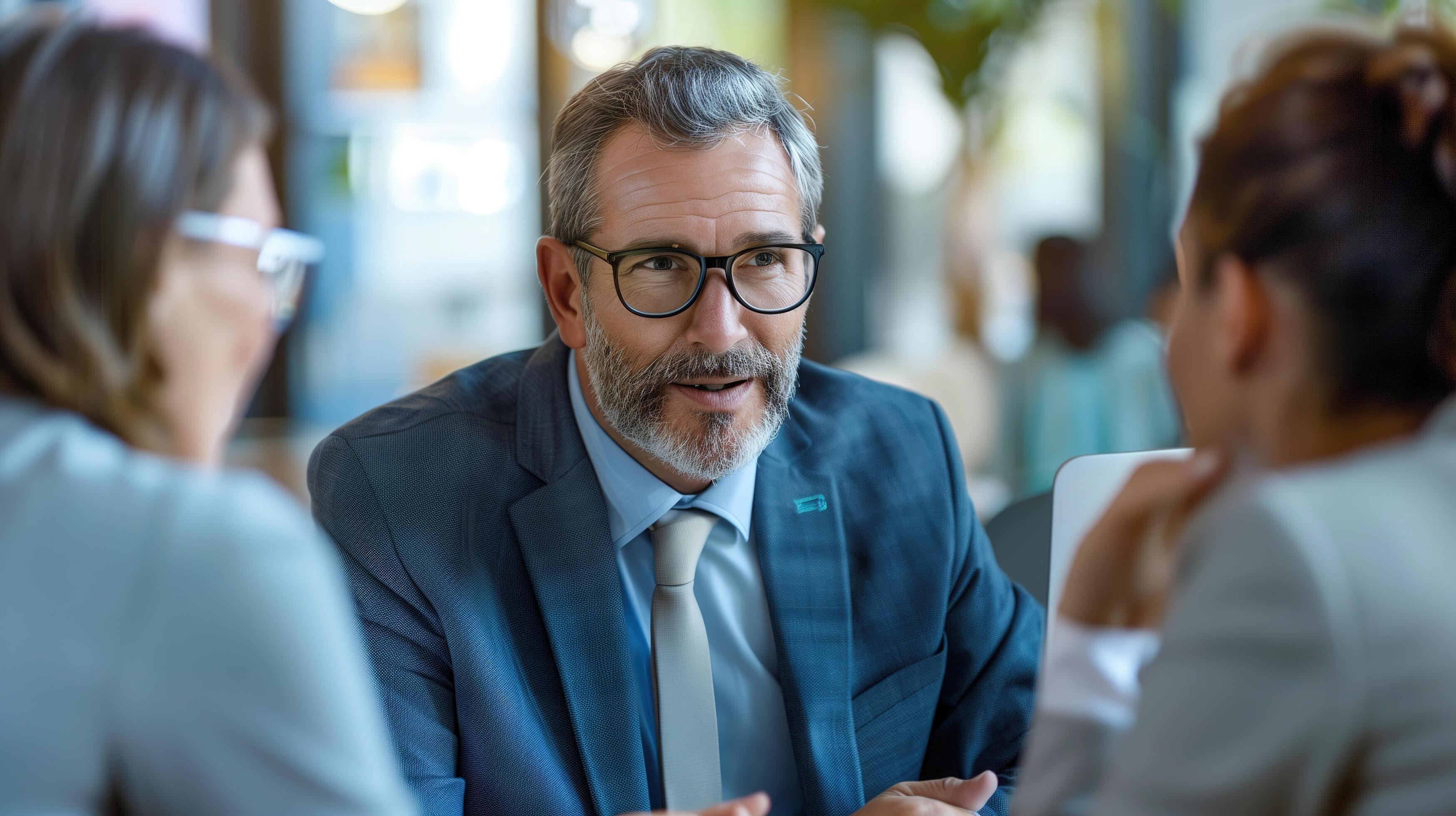 A confident financial advisor explaining investment options to attentive clients in a sleek, professional office environment Stock Free