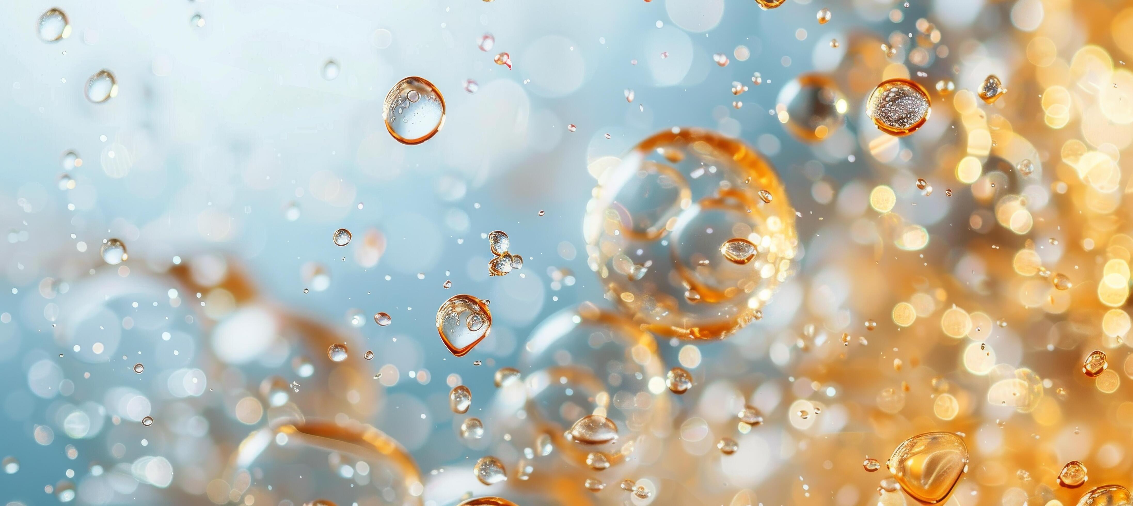 Golden Water Droplets Falling on a Blue Background Stock Free