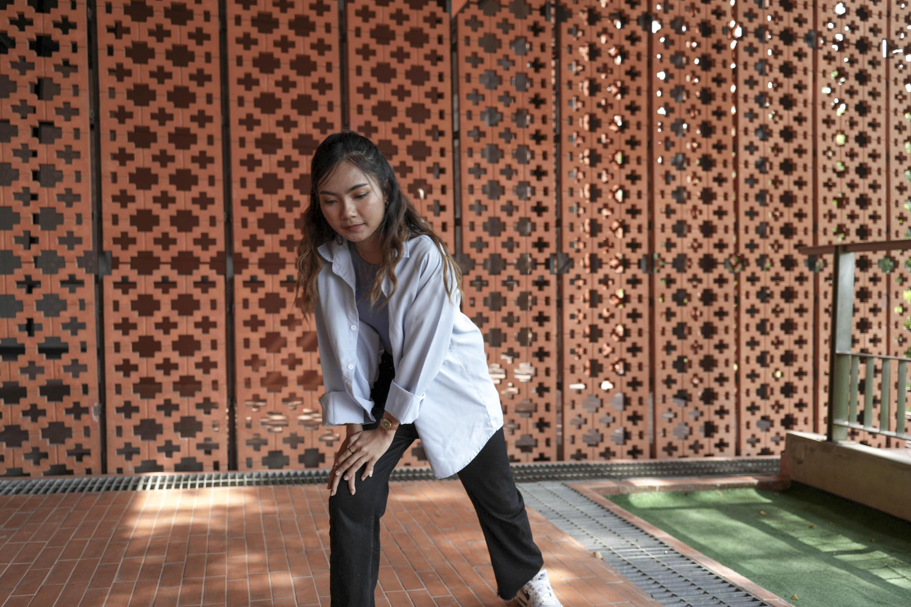 Asian women do freestyle hip hop and breakdancing in a public space in the middle of the city. With a cheerful and happy attitude Stock Free