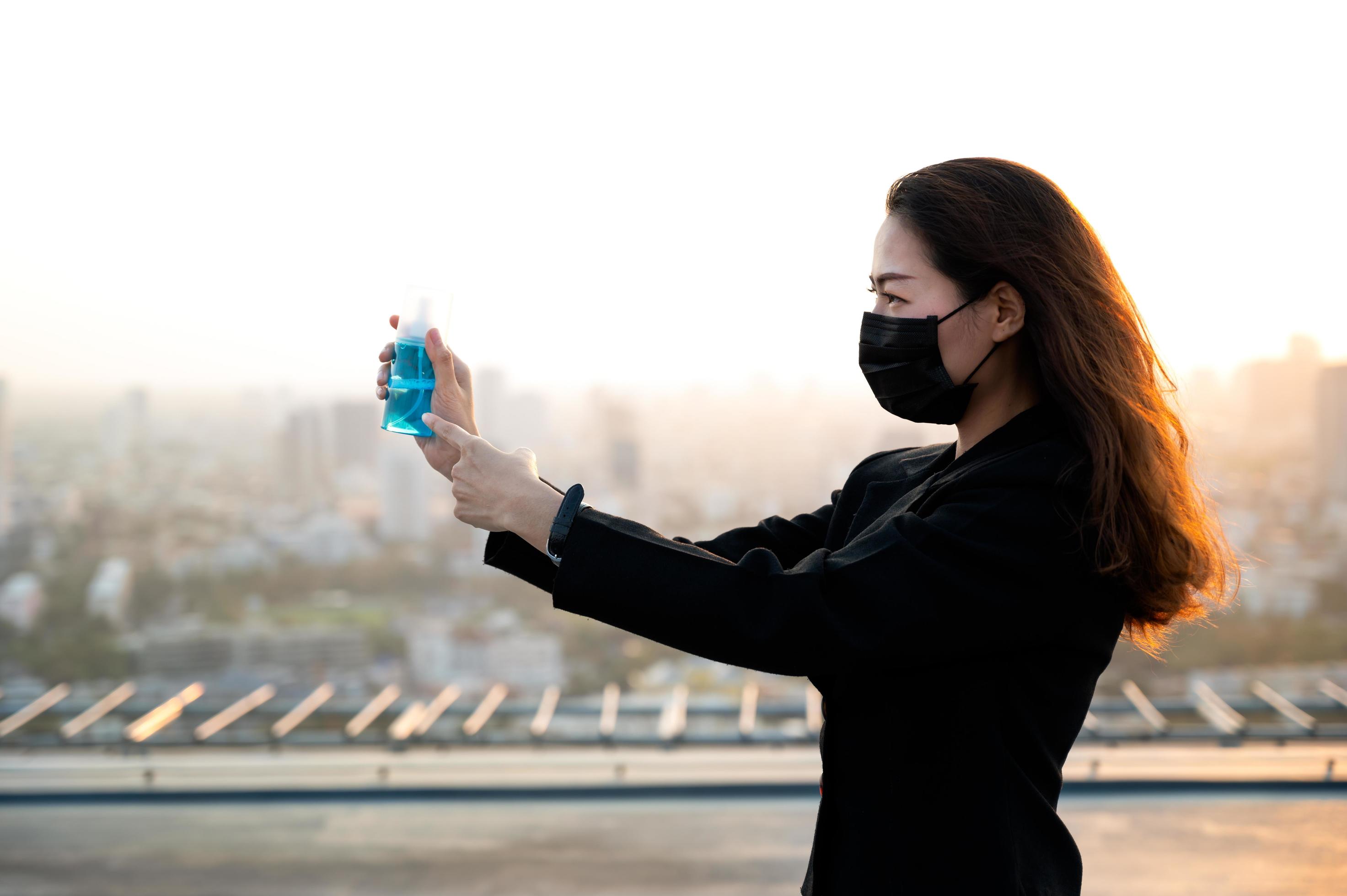 Asian business women have to use masks and goggles to protect against pollution from dust and prevent the infection from viruses Stock Free