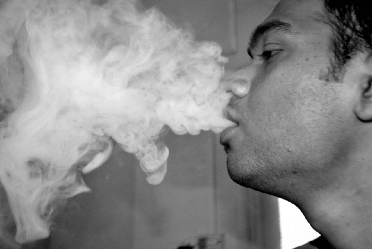 Guy Blowing Smoke Hookah Stock Free