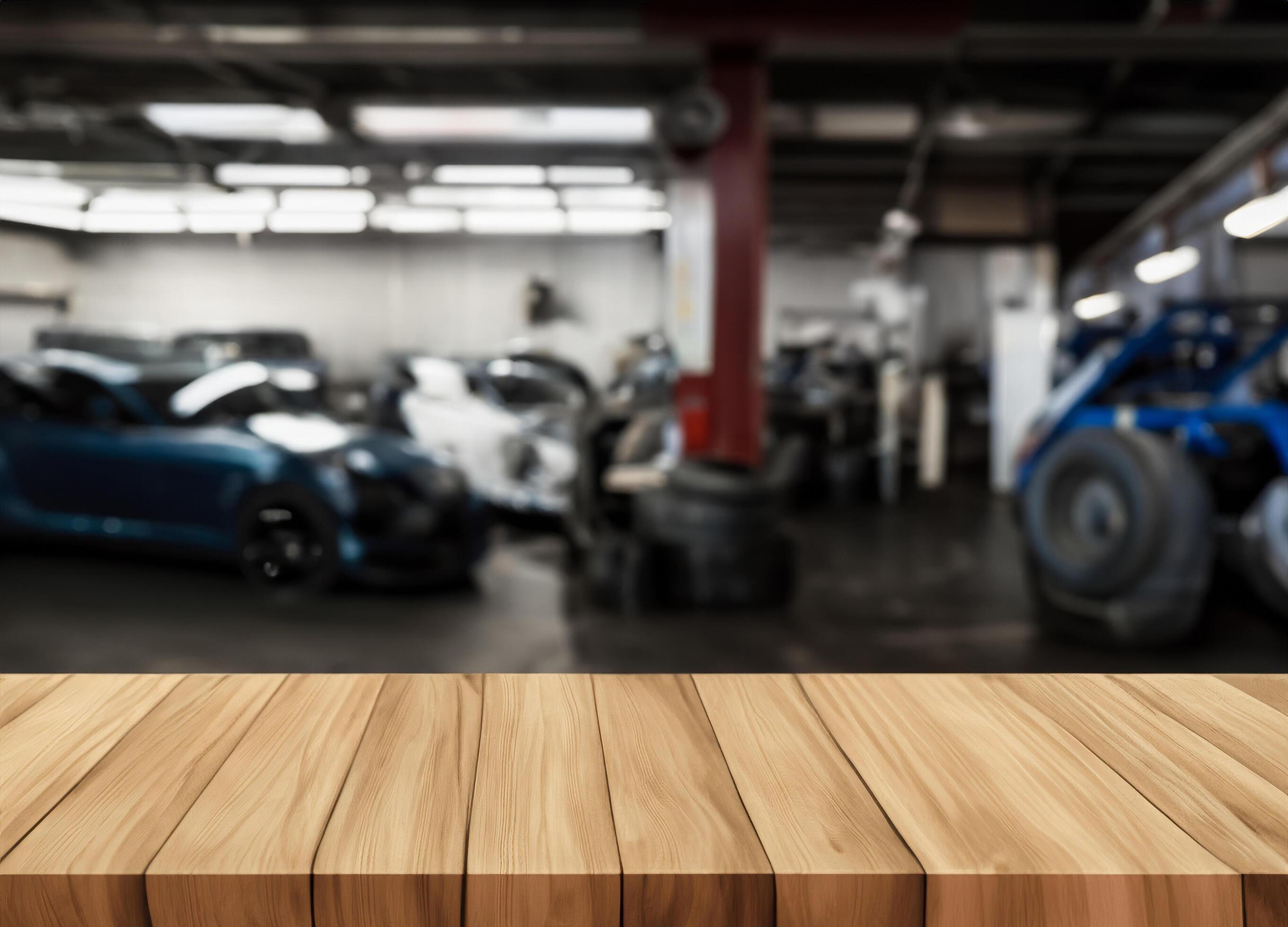 Wood table for product display in front of blurred factory garage Stock Free