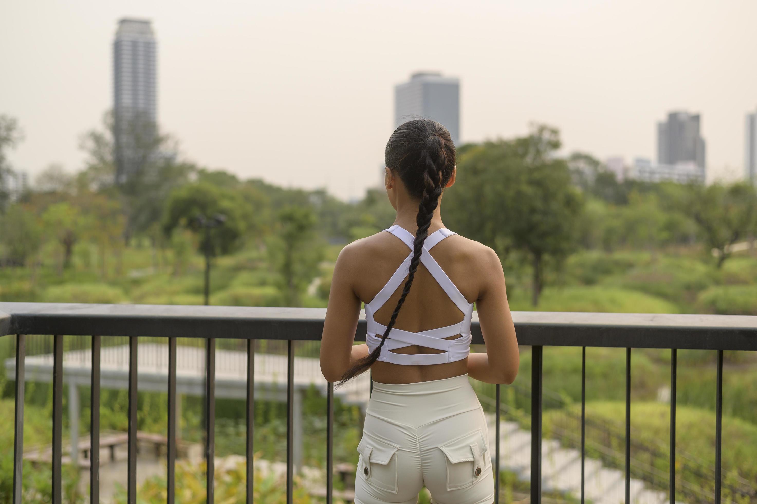 A young fitness woman in sportswear exercising in city park, Healthy and Lifestyles. Stock Free