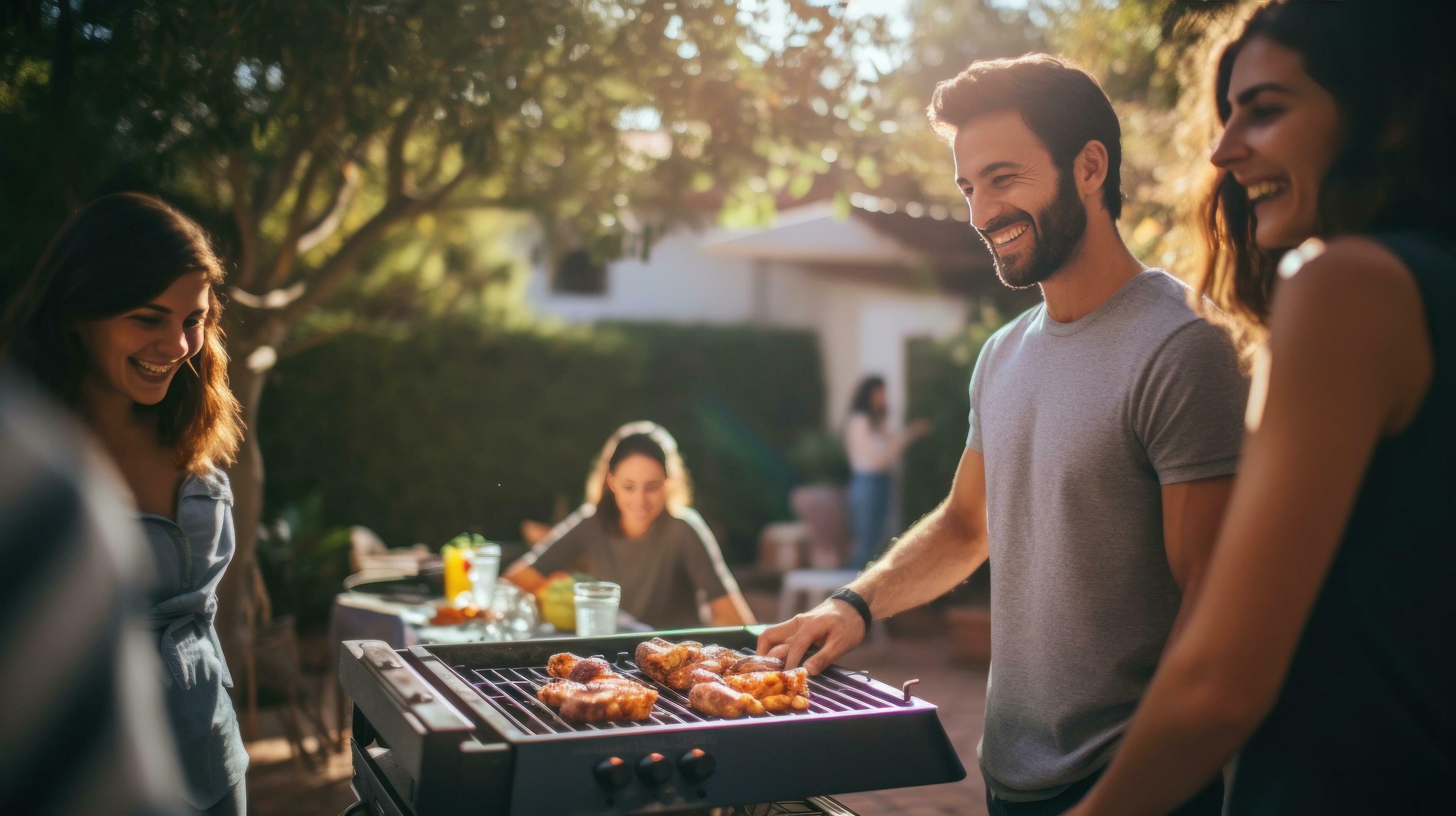 Young family is grilling at the barbecue Stock Free