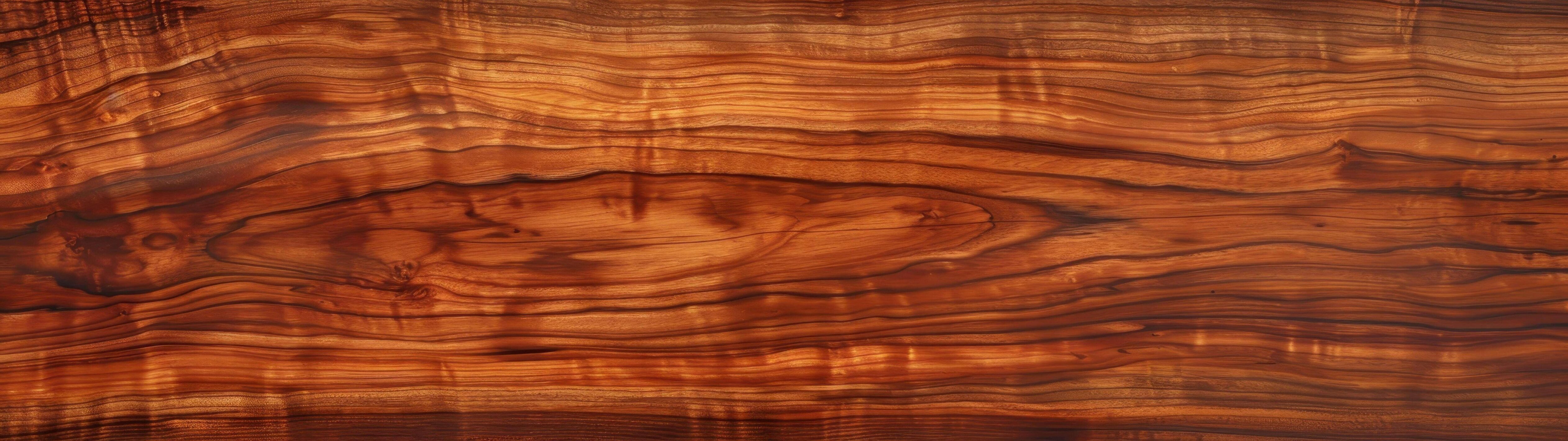 Koa wood grain background showcases rich, swirling patterns Stock Free