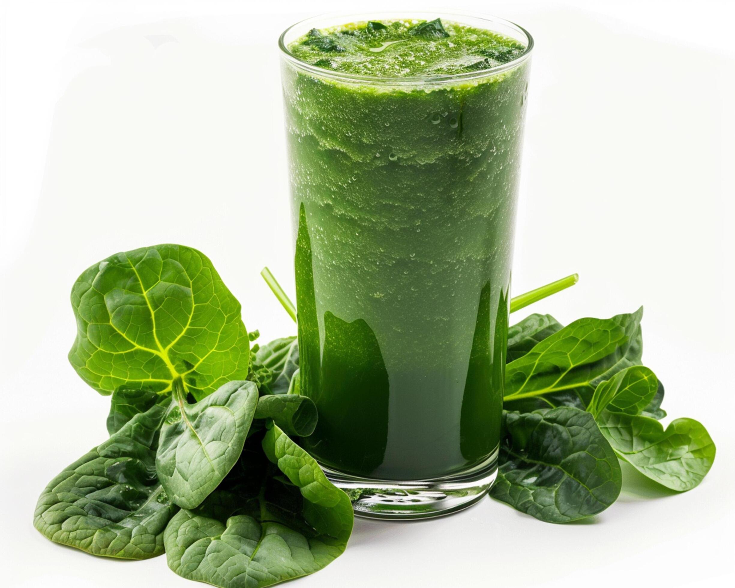 a glass of green smoothie with spinach leaves Stock Free