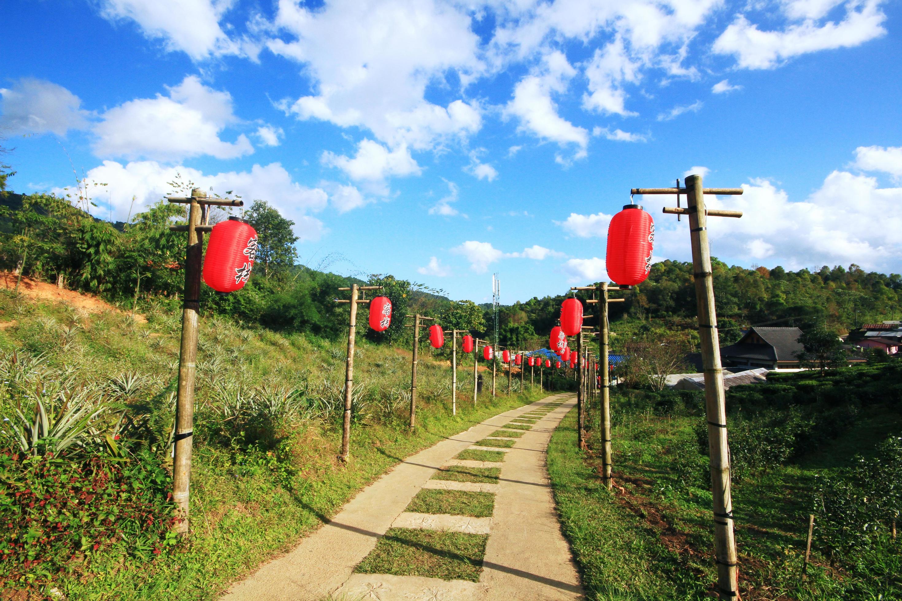 Beautiful red paper Chinese lanterns decoration on walkway of Lee Wine Ruk Thai Resort located on the mountain, Thailand Stock Free